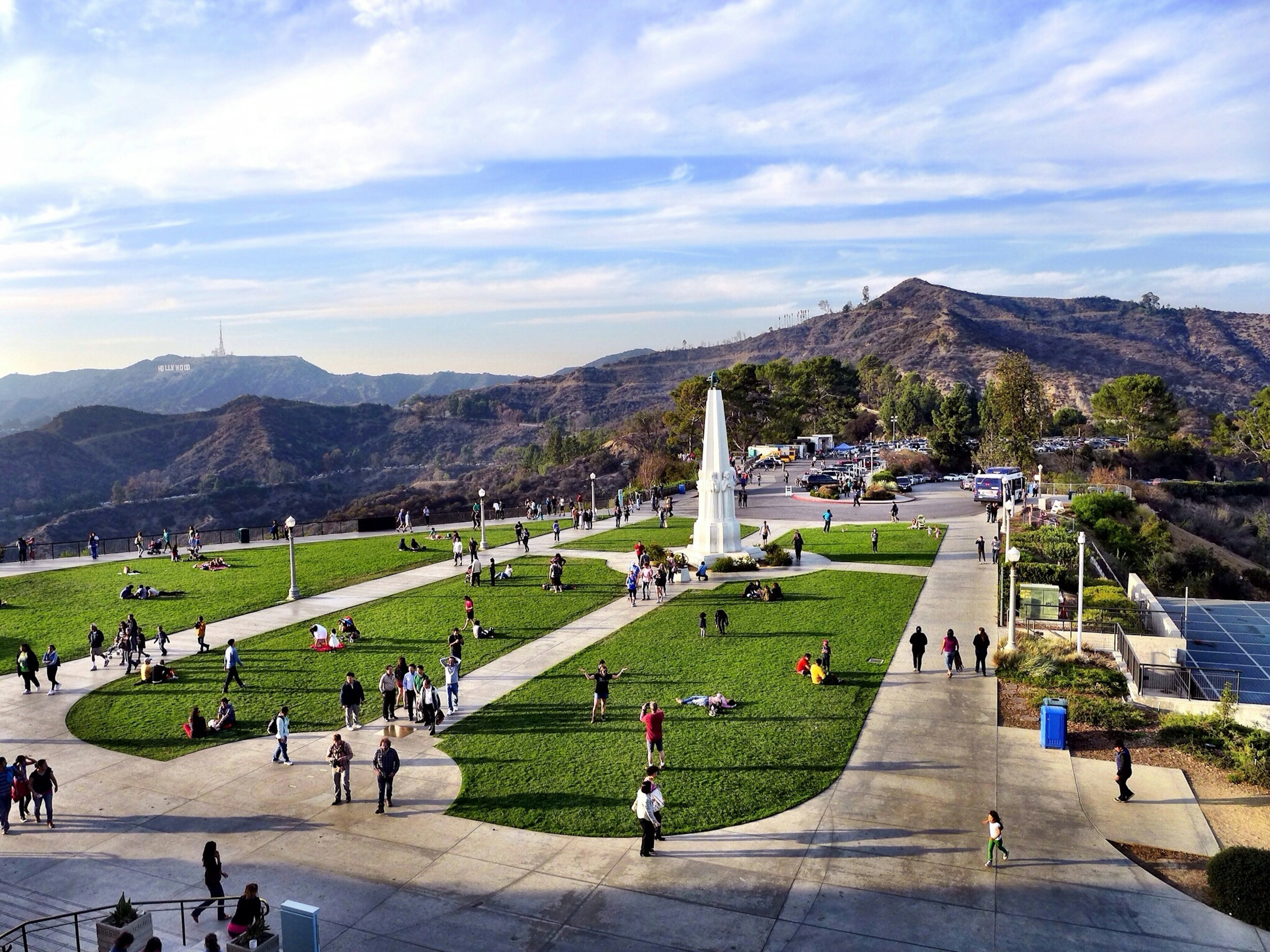 A manicured park surrounded by mountains