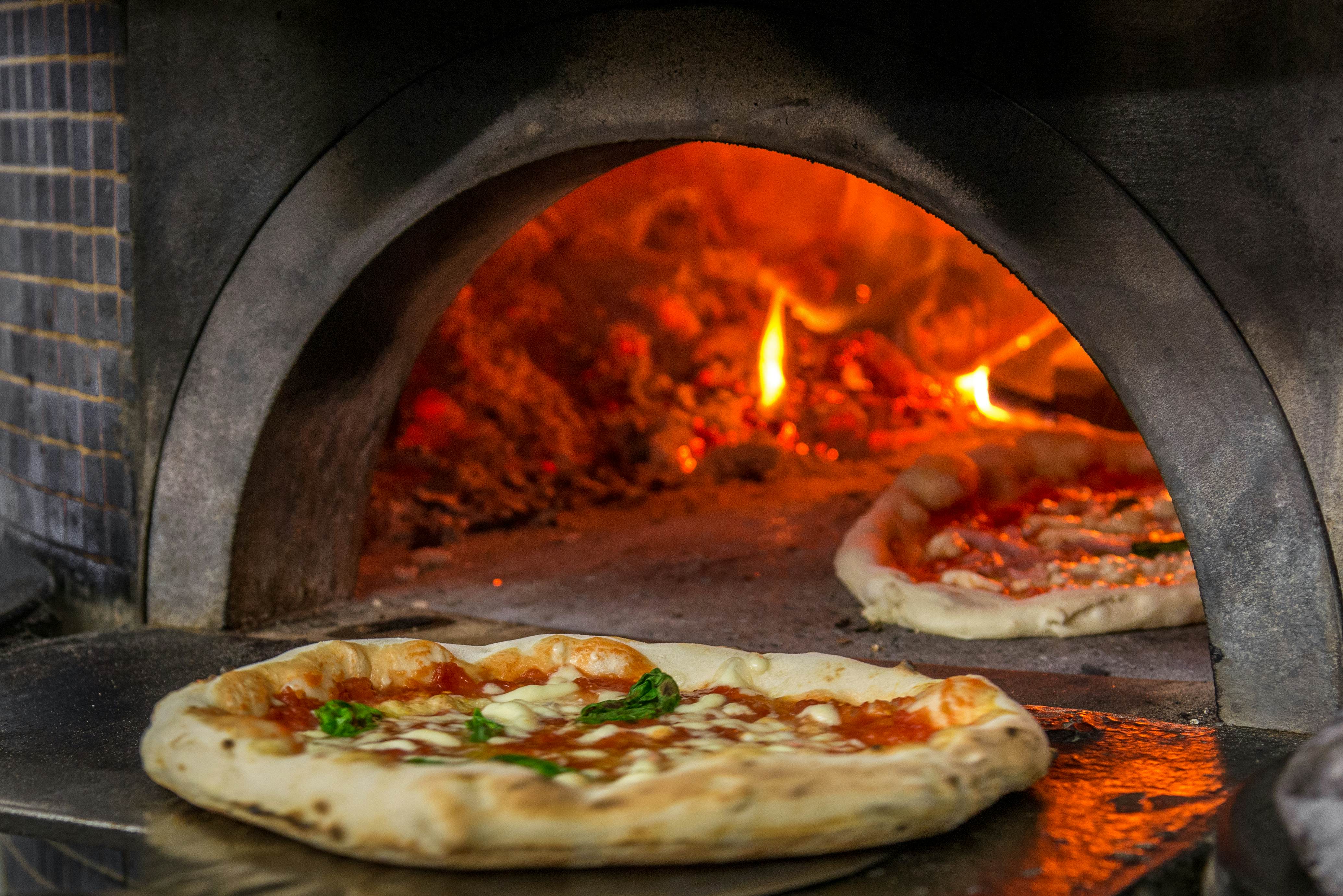 A pizza oven in one of the most famous pizzerias of Naples, Italy.