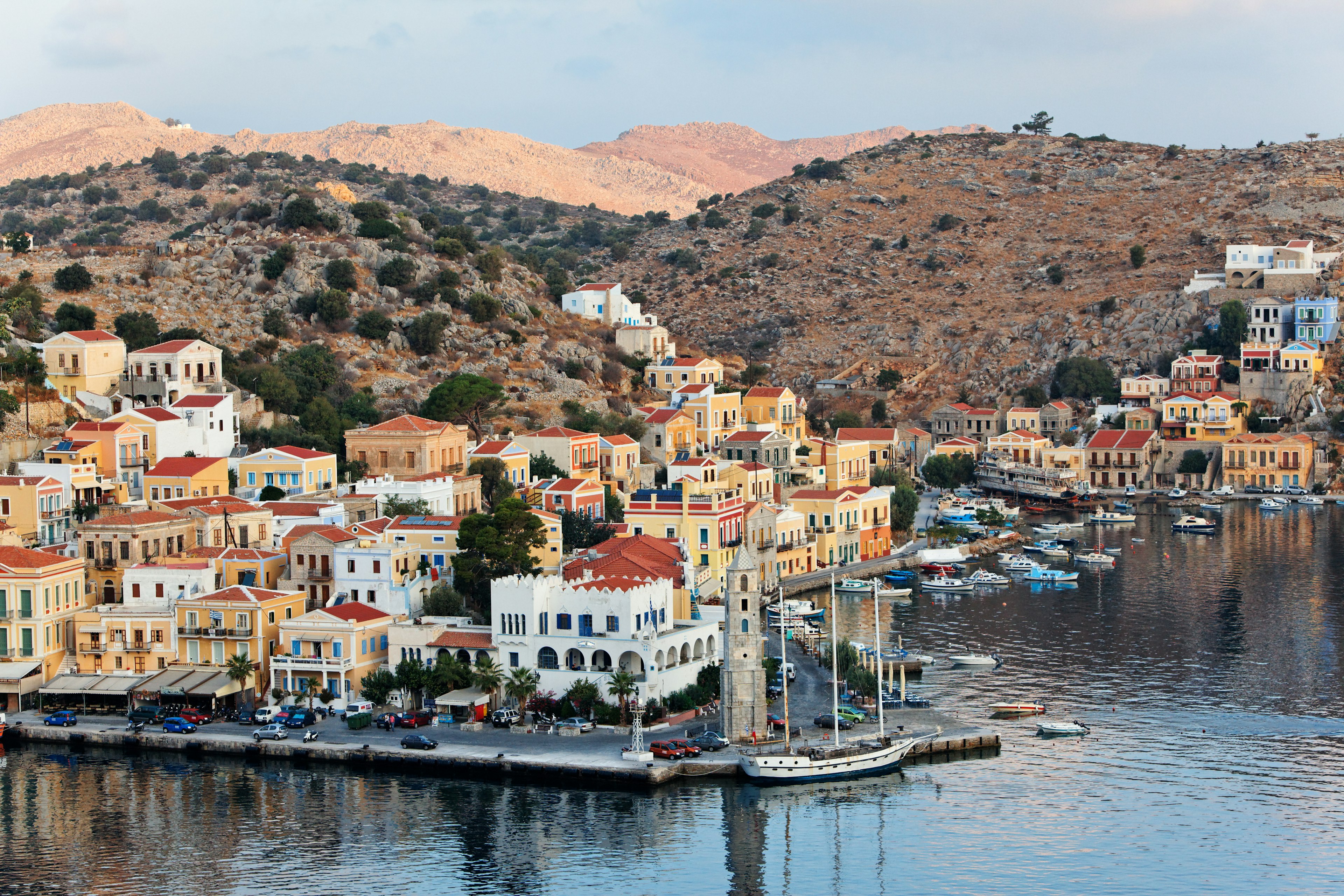 A Greek seaside village with houses built on the rocky hills