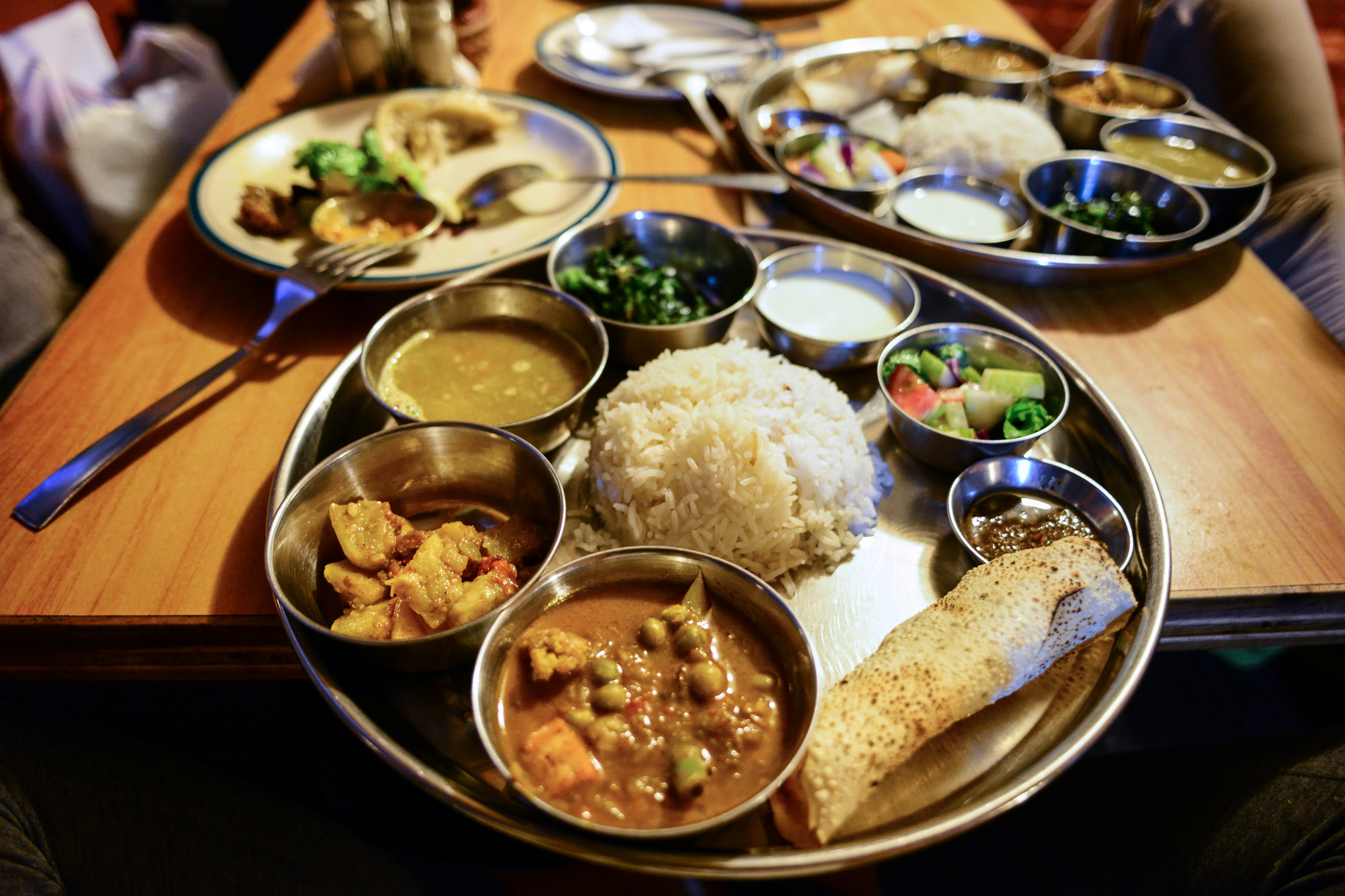 A platter of rice, vegetables and lentil curry in a restaurant in Nepal