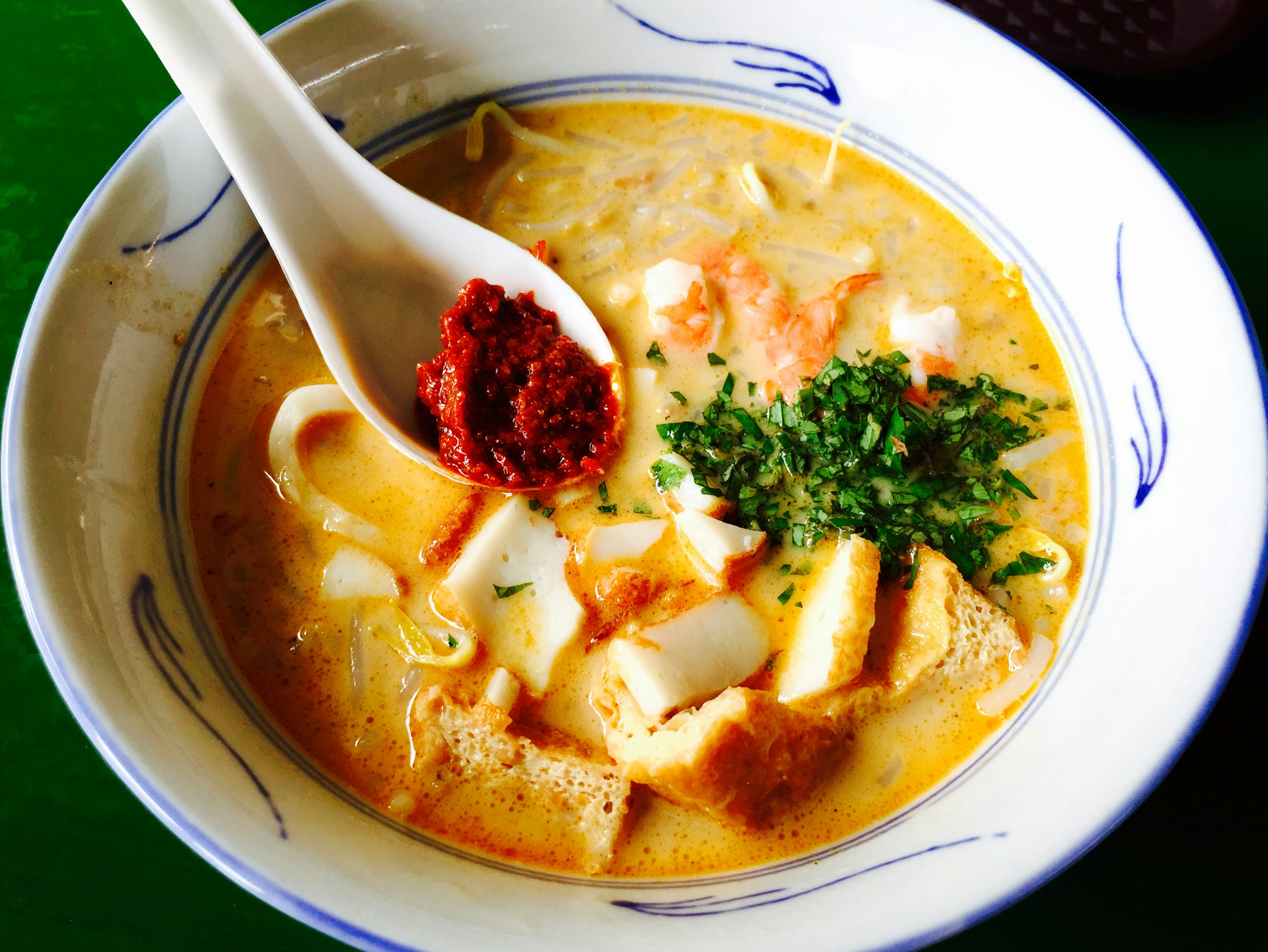 A bowl of Katong Laksa is pictured. Laksa is a popular spicy noodle soup in Peranakan cuisine