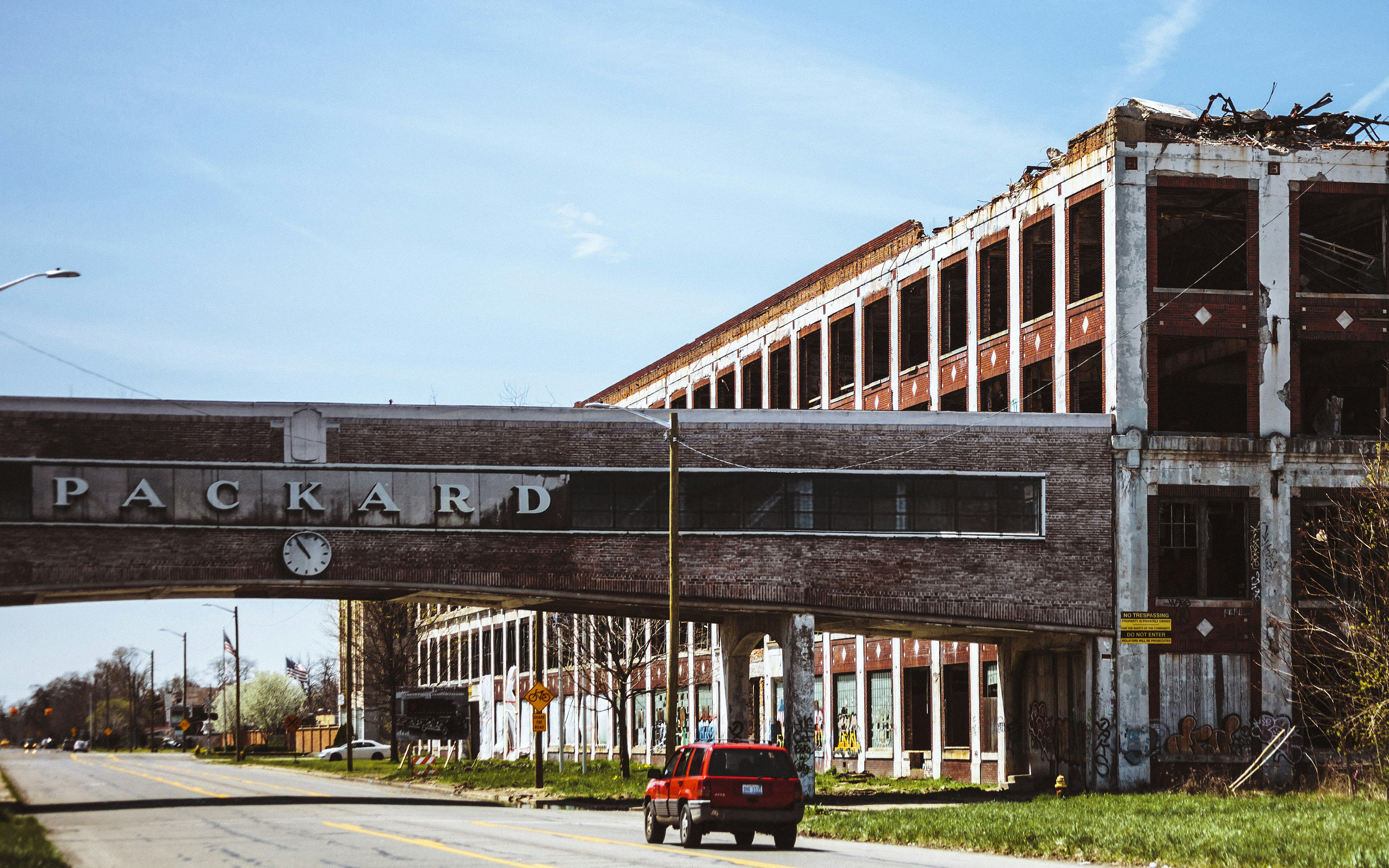 A car passing by the famous abandoned Packard plant in Detroit.