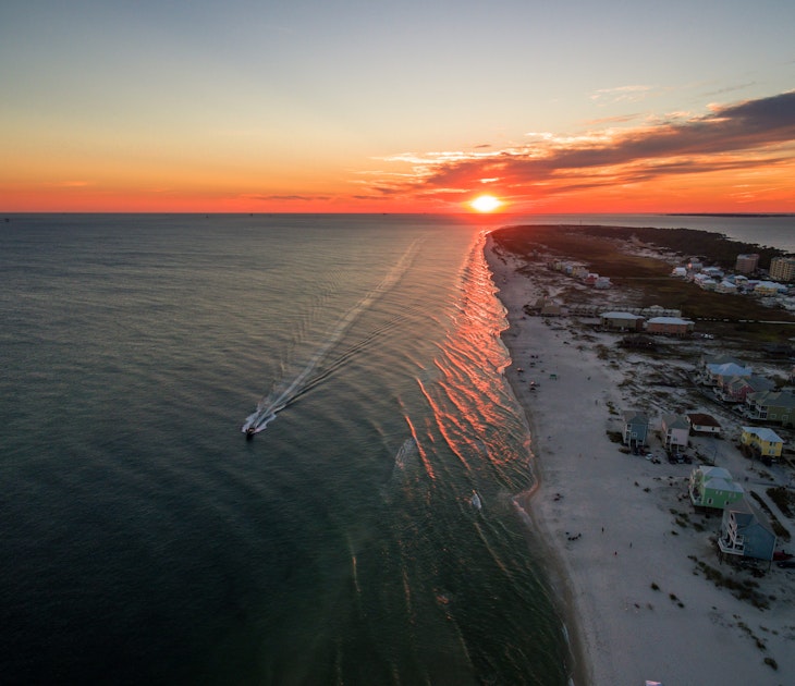 Gulf Shores is famous for its white sand beaches and great weather
618735602
Gulf Shores, Travel, Photography, Beauty In Nature, Landscaped, Scenics, Majestic, Awe, Journey, Relaxation, Adventure, Blue, Vacations, Aerial View, Alabama, Southern USA, USA, The Americas, Sunset, Sunrise - Dawn, Sand, Island, Beach, Landscape, Gulf of Mexico, Sea, Water, Nautical Vessel, fort morgan, Mobile Bay, White Sand