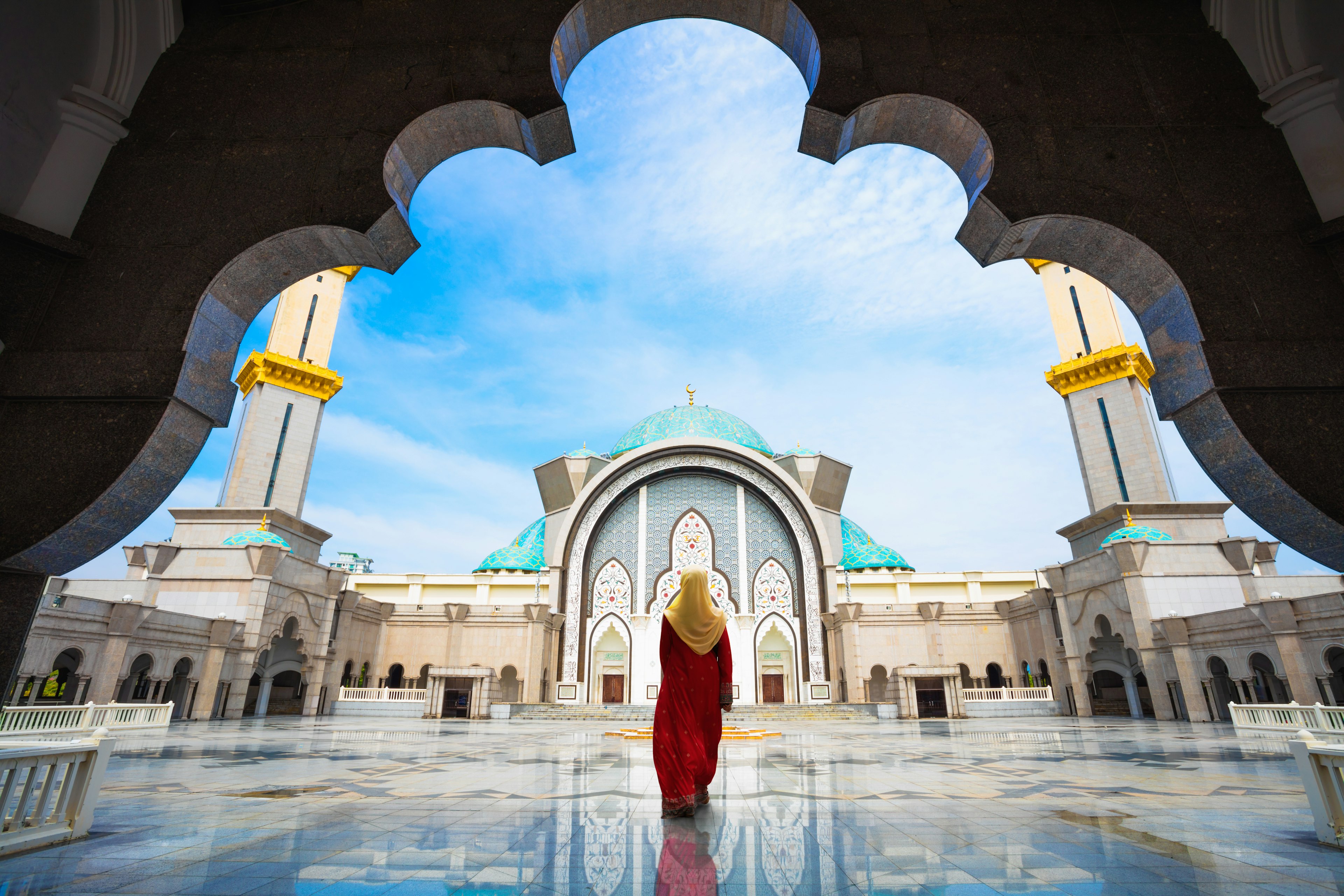 A woman enters the Federal Territory Mosque in Kuala Lumpur