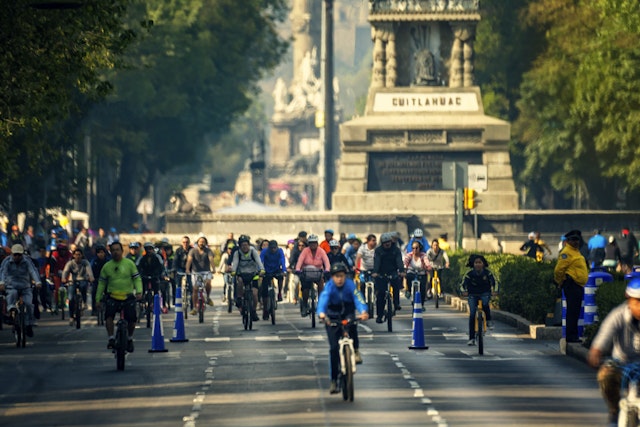 People ride bicycles on Reforma Ave in Mexico, Mexico