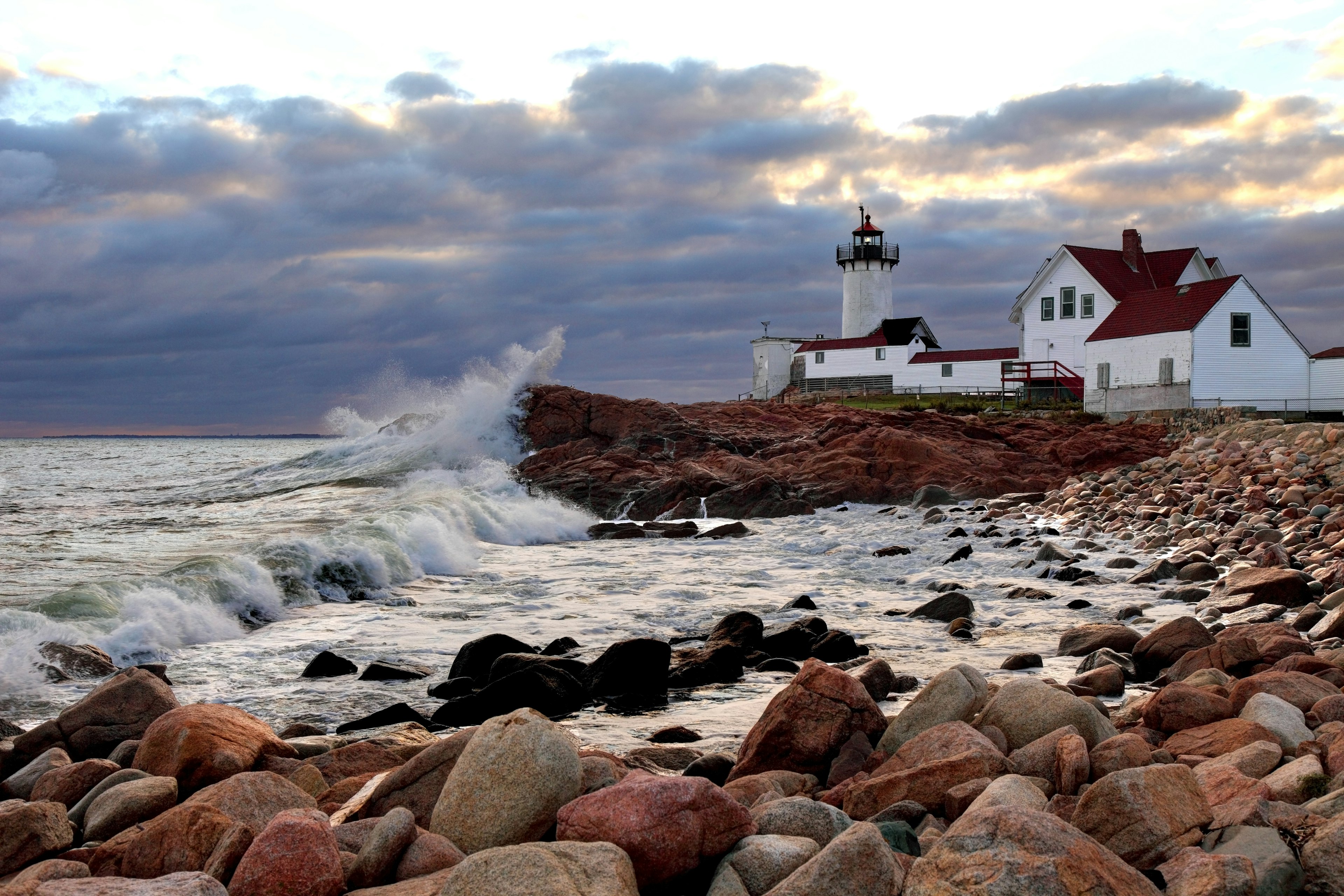 Wave crash on the rocks near Eastern Point Lighthouse on the eastern tip of Massachusetts, Gloucester Harbor, Gloucester, Massachusetts, New England, USA