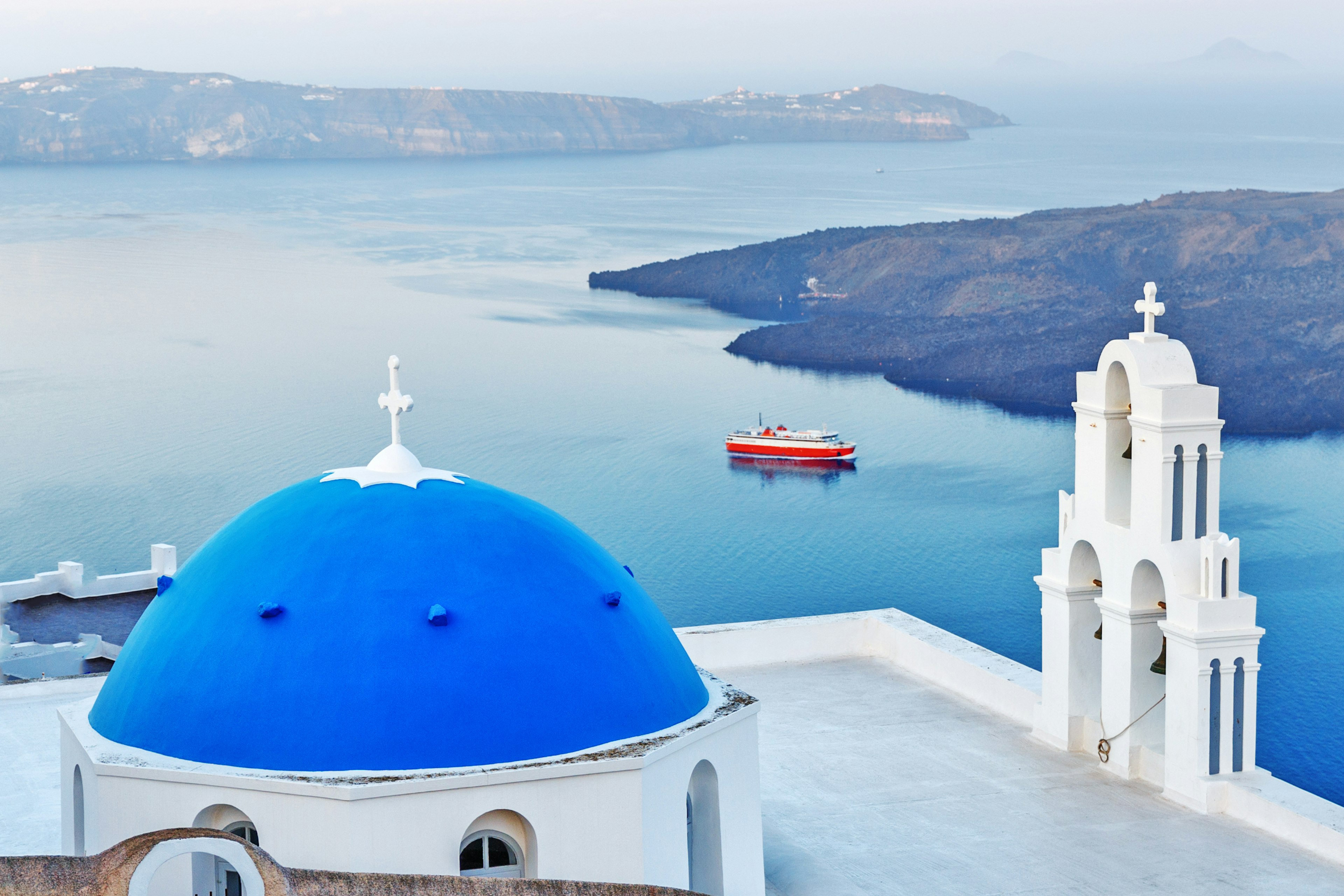 View over a blue dome church on Santorini, Greece