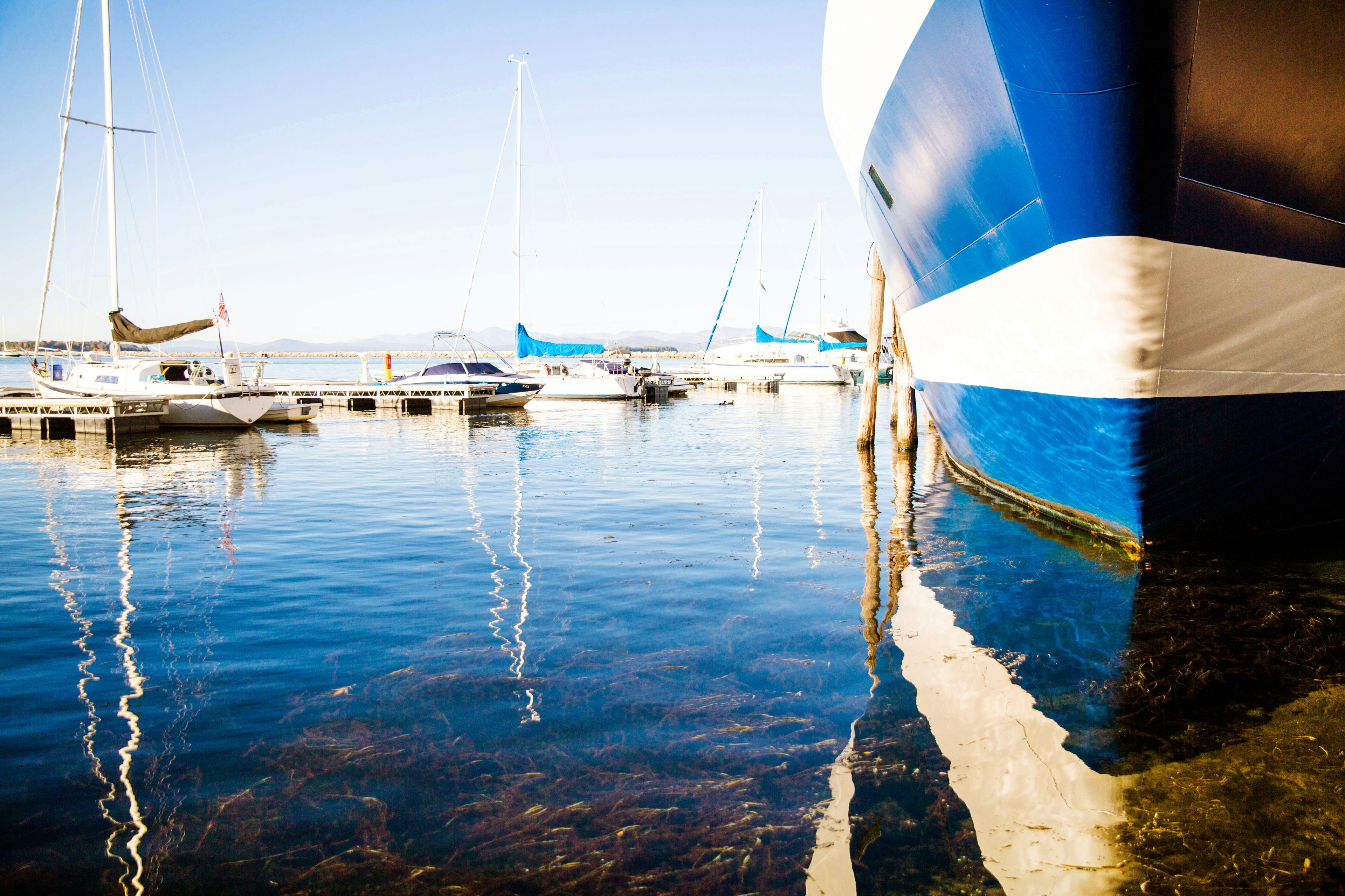 Boats on a very still Lake Champlain at Sunset