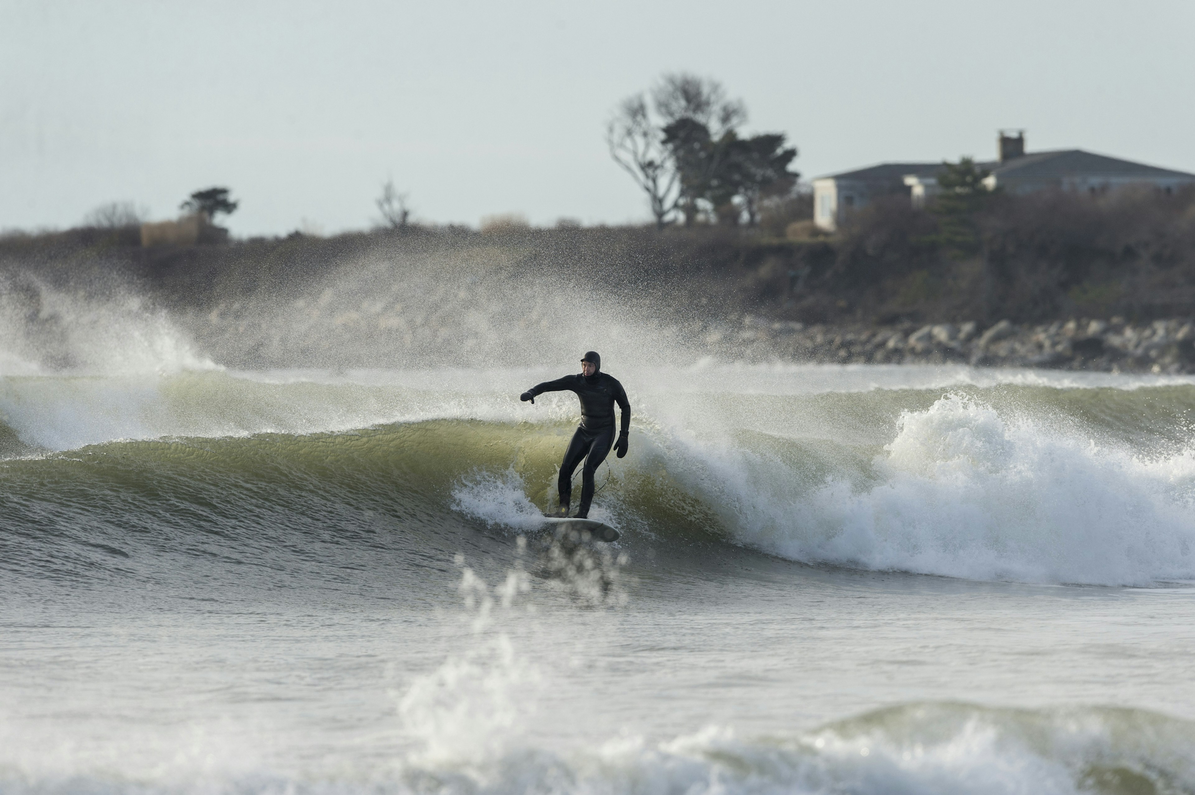 Surfer on middle wave in a set at Goosewing Beach Rhode Island