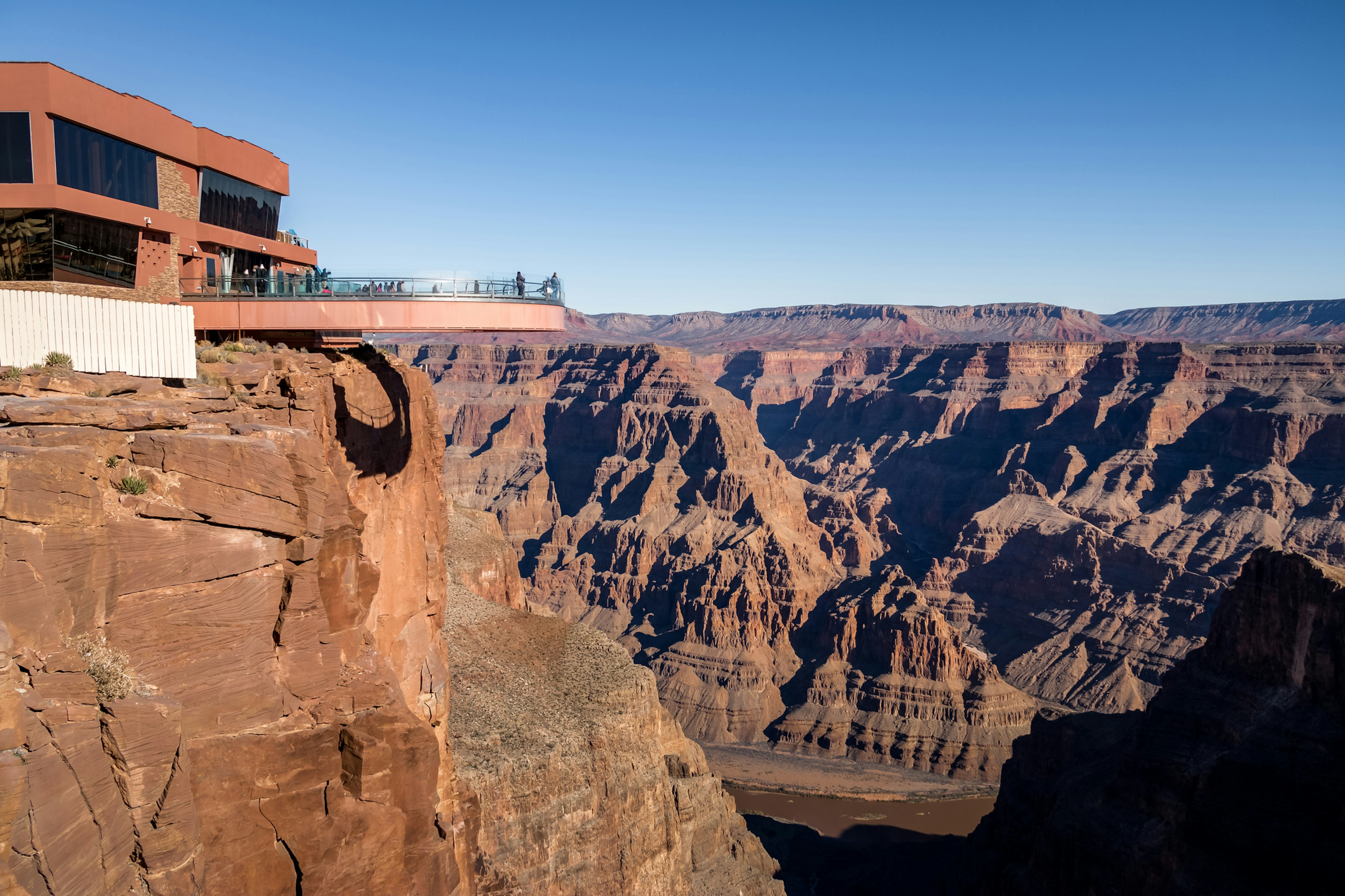 People walk on the Skywalk bridge at Grand Canyon West Rim in Arizona