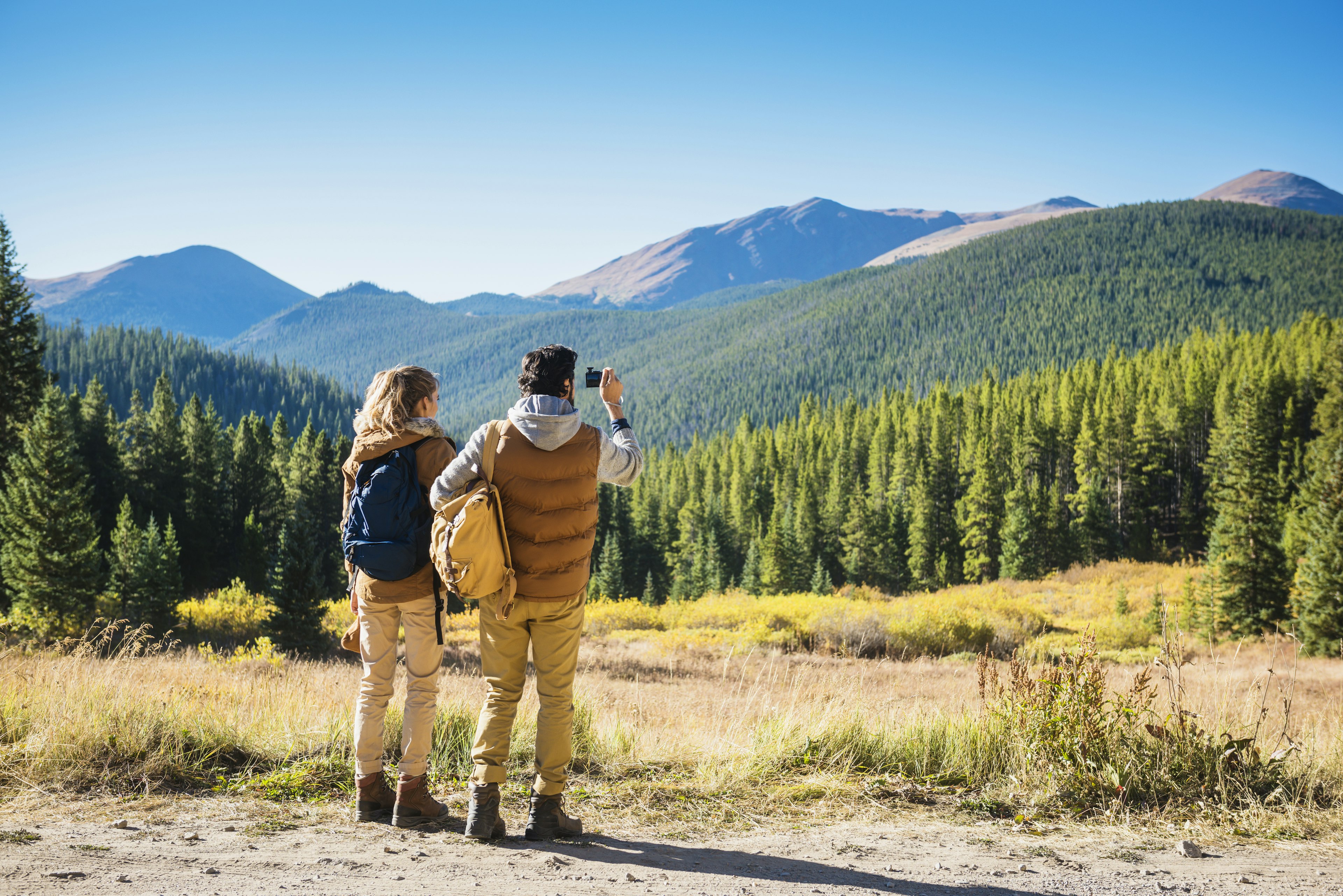 A couple hiking in mountain scenery near Breckenridge, Colorado