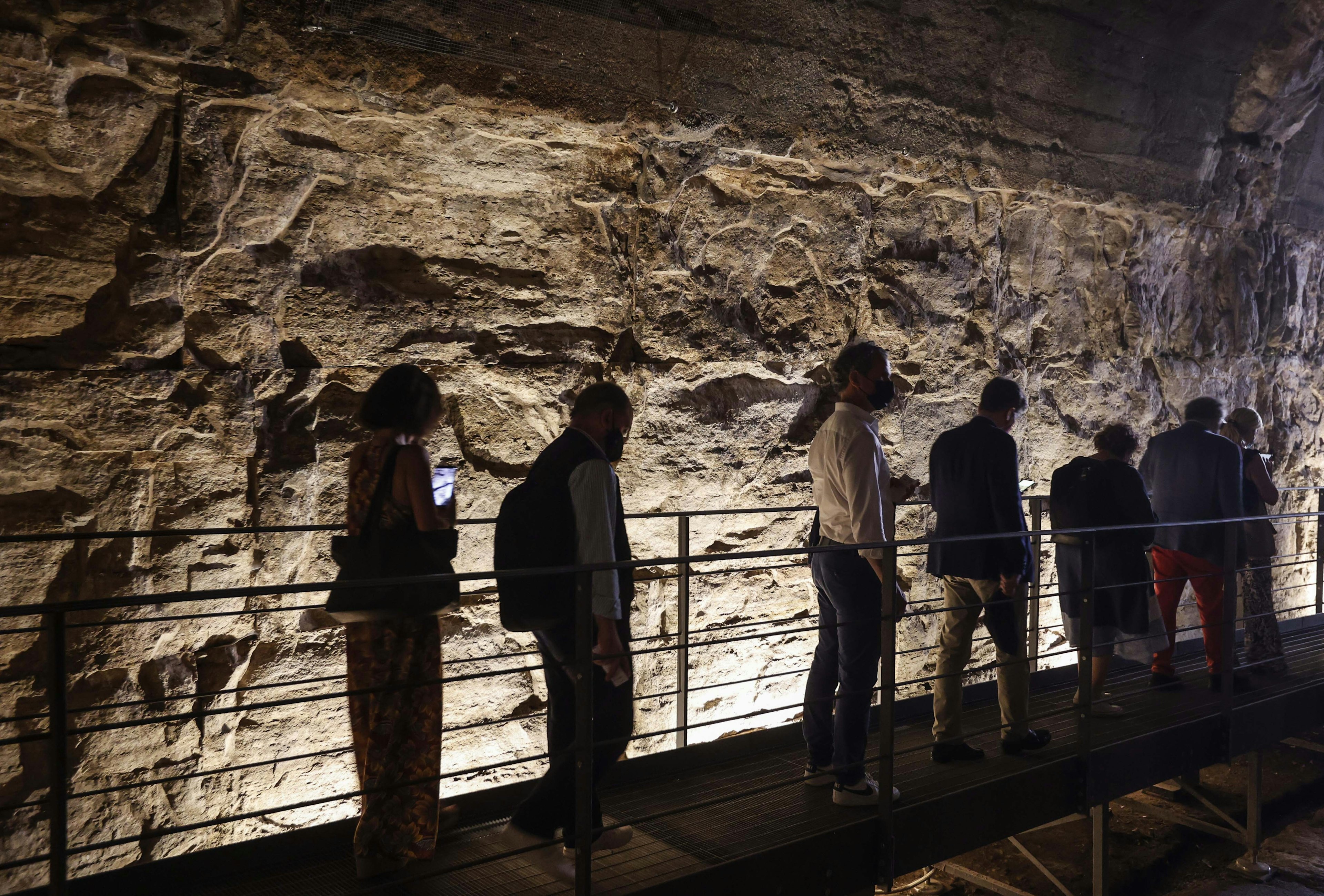 A group of reporters and guests enter the Hypogea area of the Colosseum