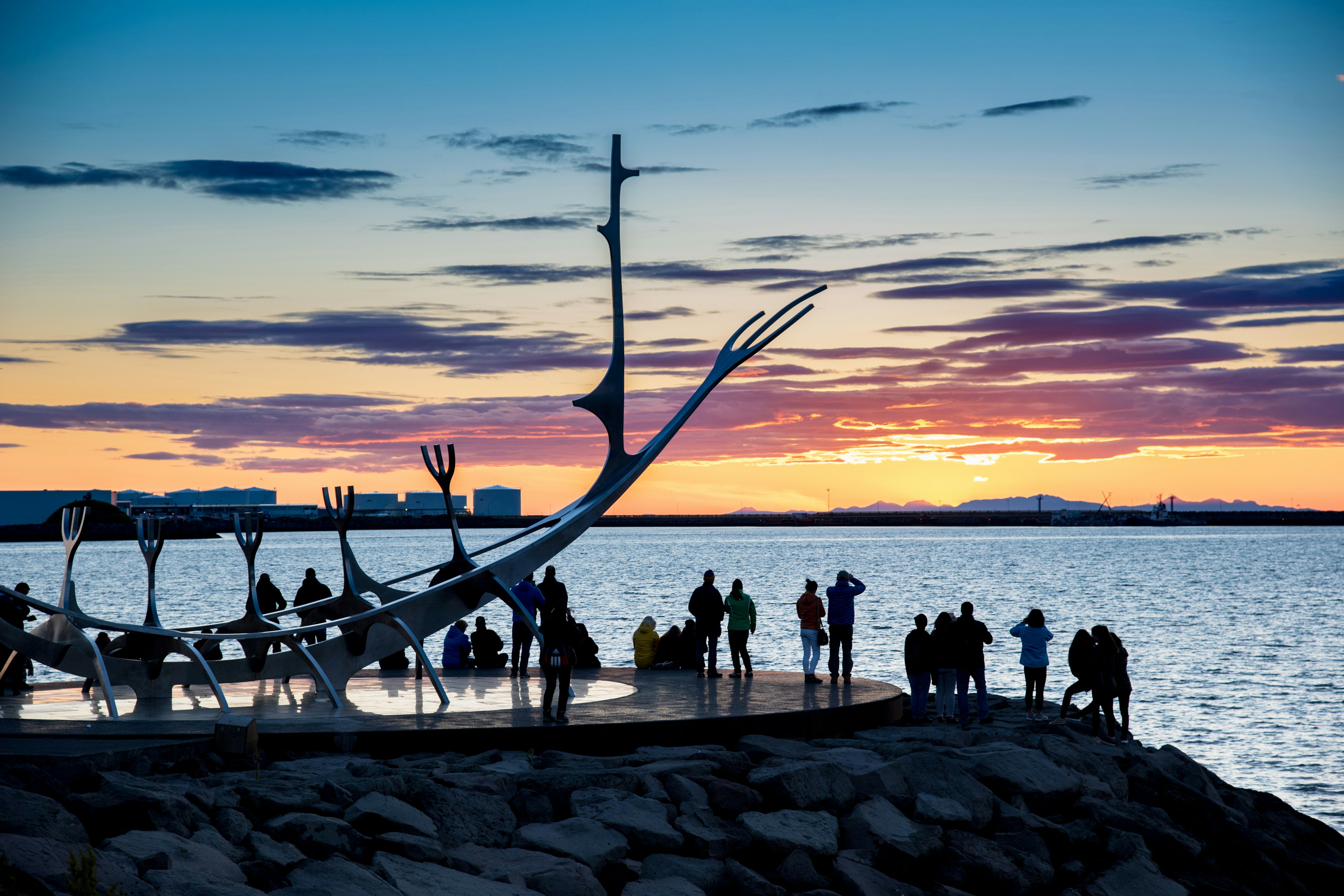 People gathered around the Sun Voyager sculpture in Reykjavik