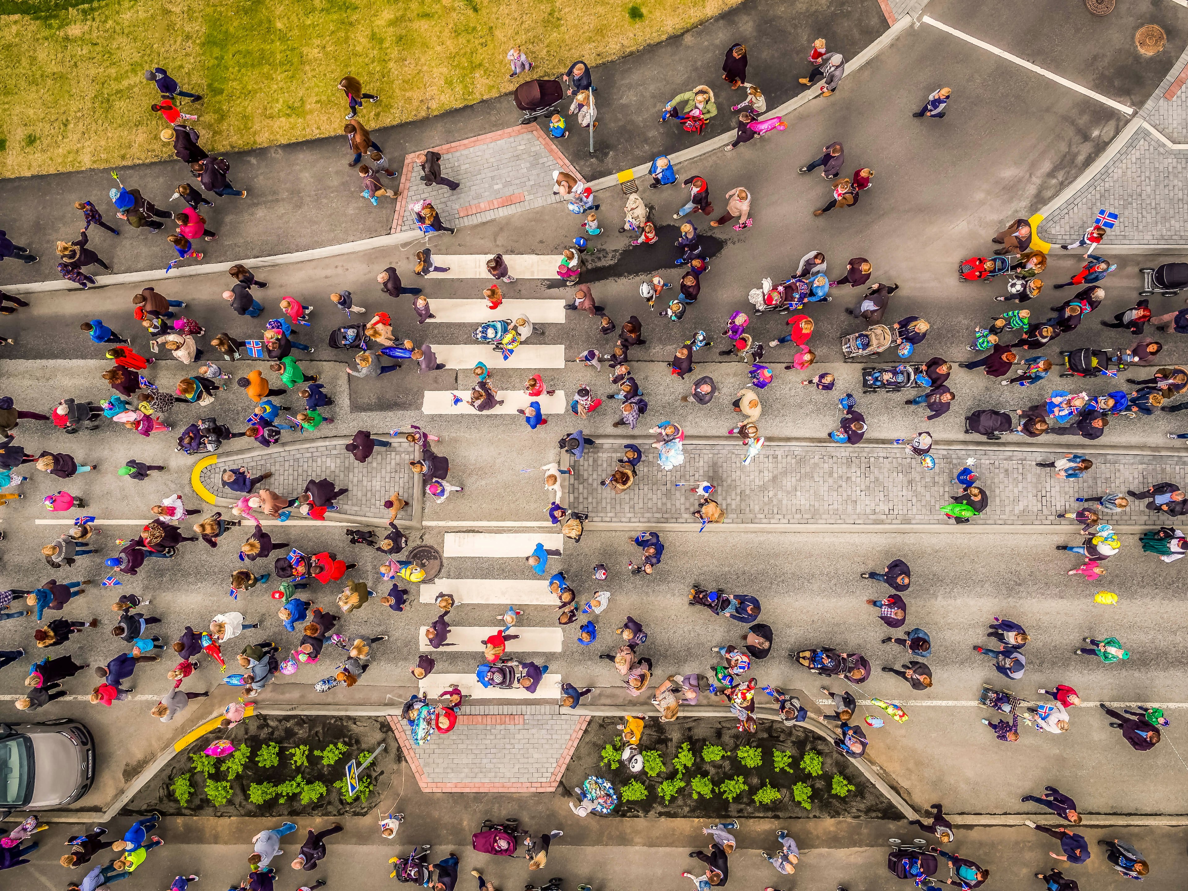 Aerial view, shot by drone: People celebrating Iceland's Independence day in a suburb of Reykjavik, Kopavogur, Iceland