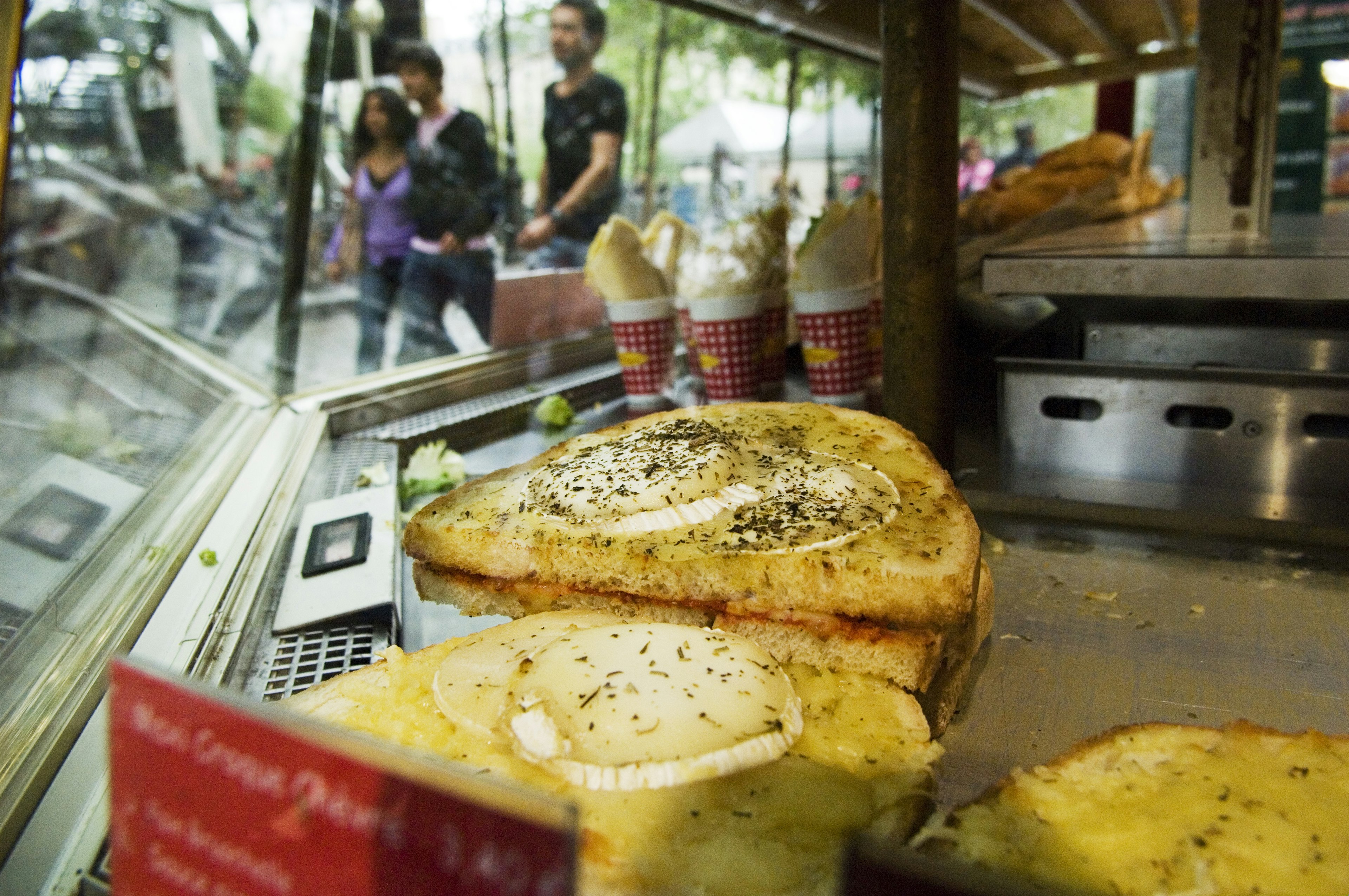 Three Maxi Croque Chevre (sandwiches with egg on top) on sale to takeaway in Paris