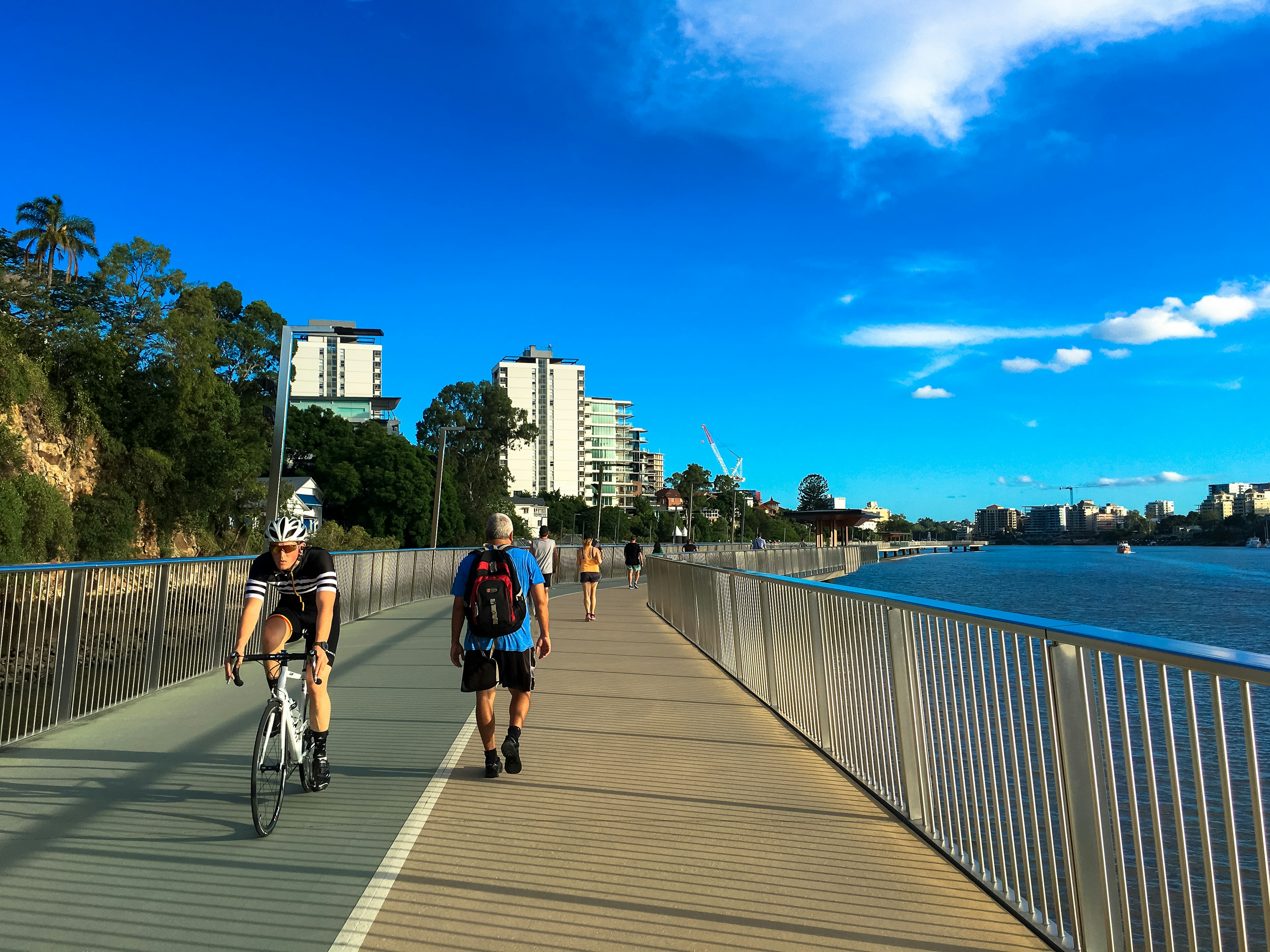 Brisbane Riverwalk with a runner and a cyclist