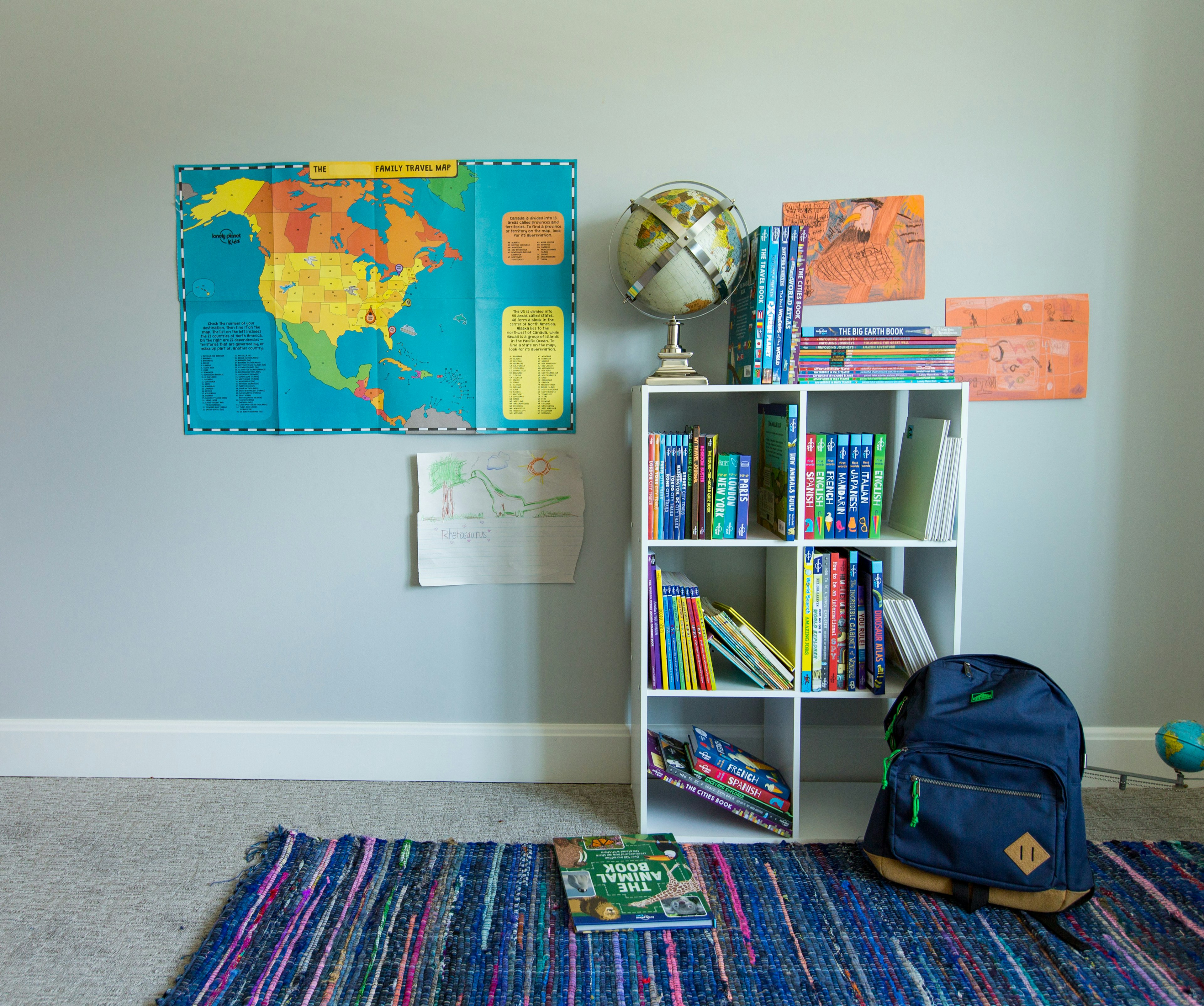 Home classroom scene with books on shelves and a map on the wall