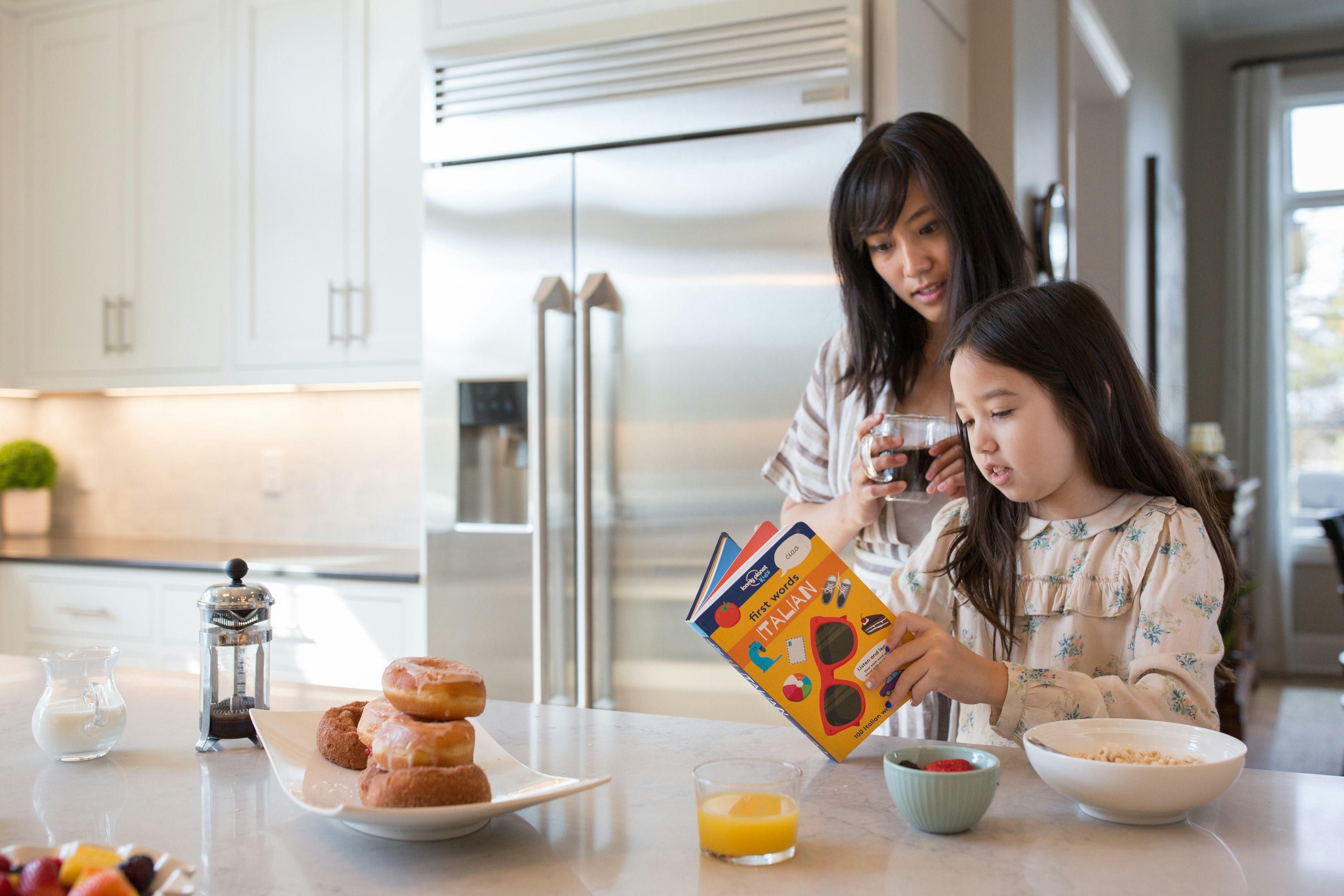 Mother and daughter with book - LP Kids Lifestyle