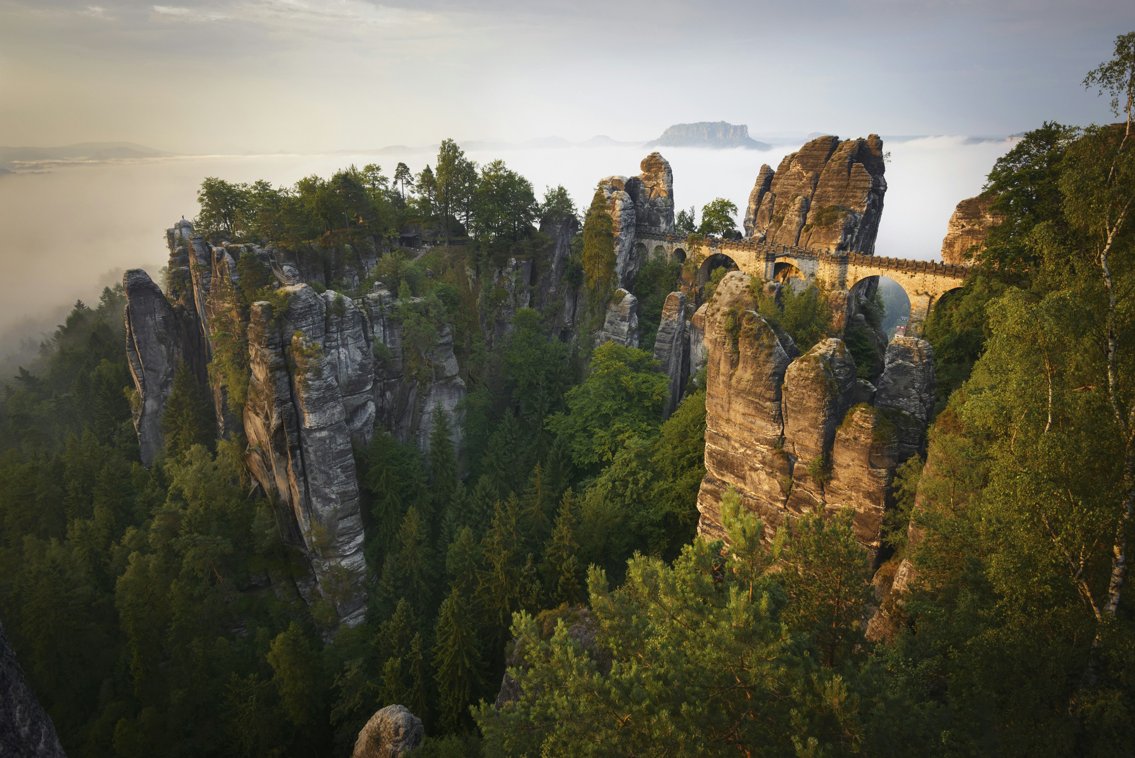 Bastei Bridge at dawn, with mist filling the valley of the Elbe in Saxon Switzerland, Germany