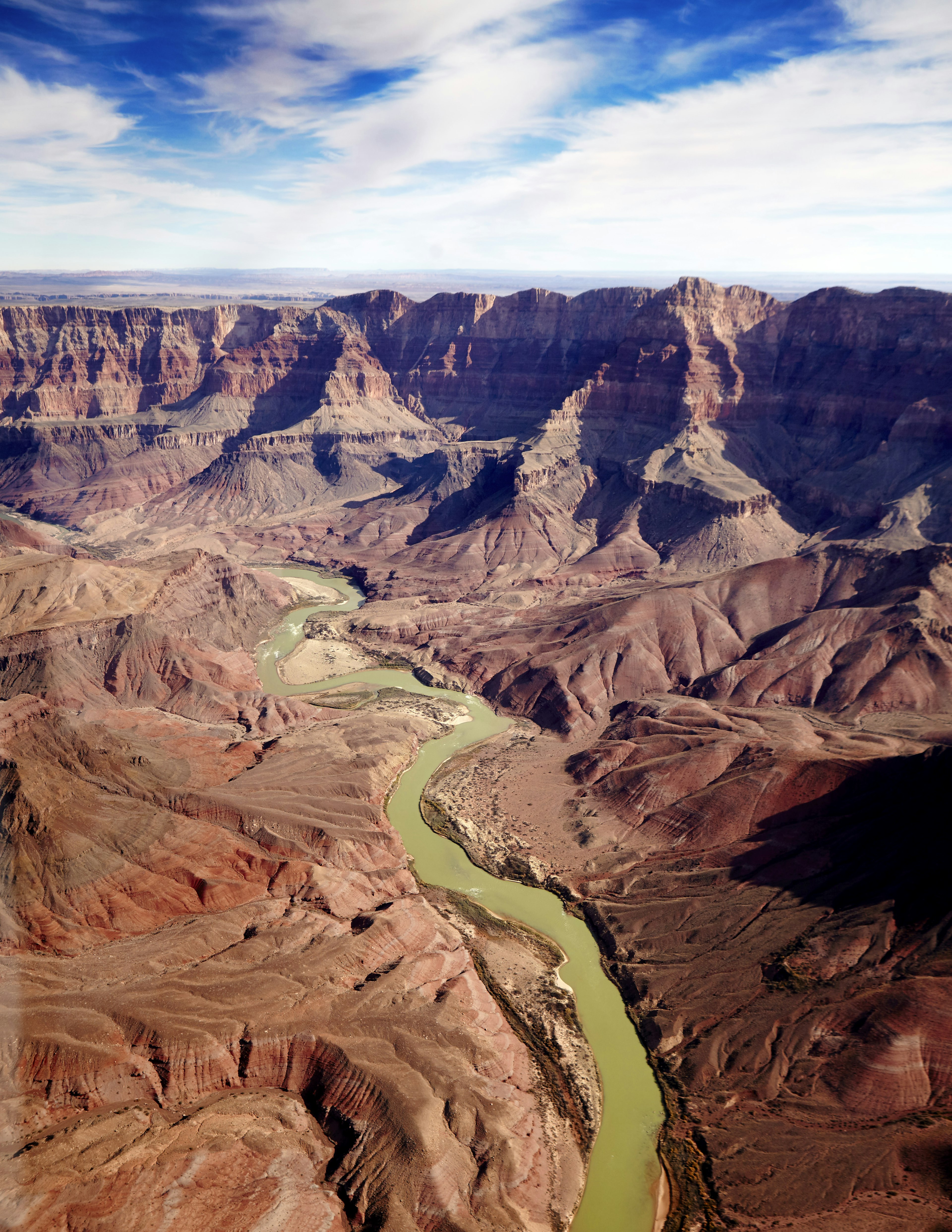 A deep canyon with a river running through the middle