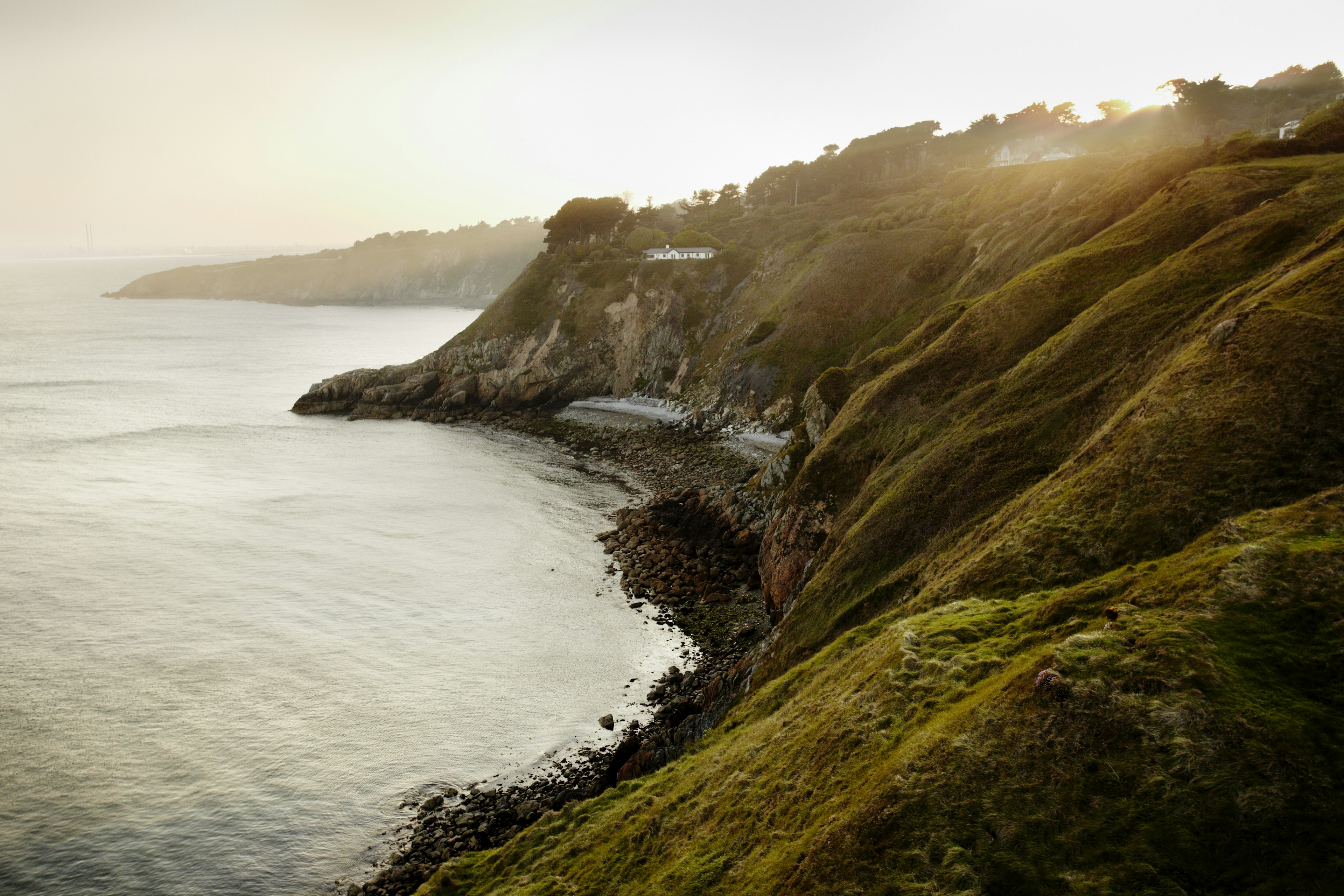 An Irish coastline in the fading evening light.