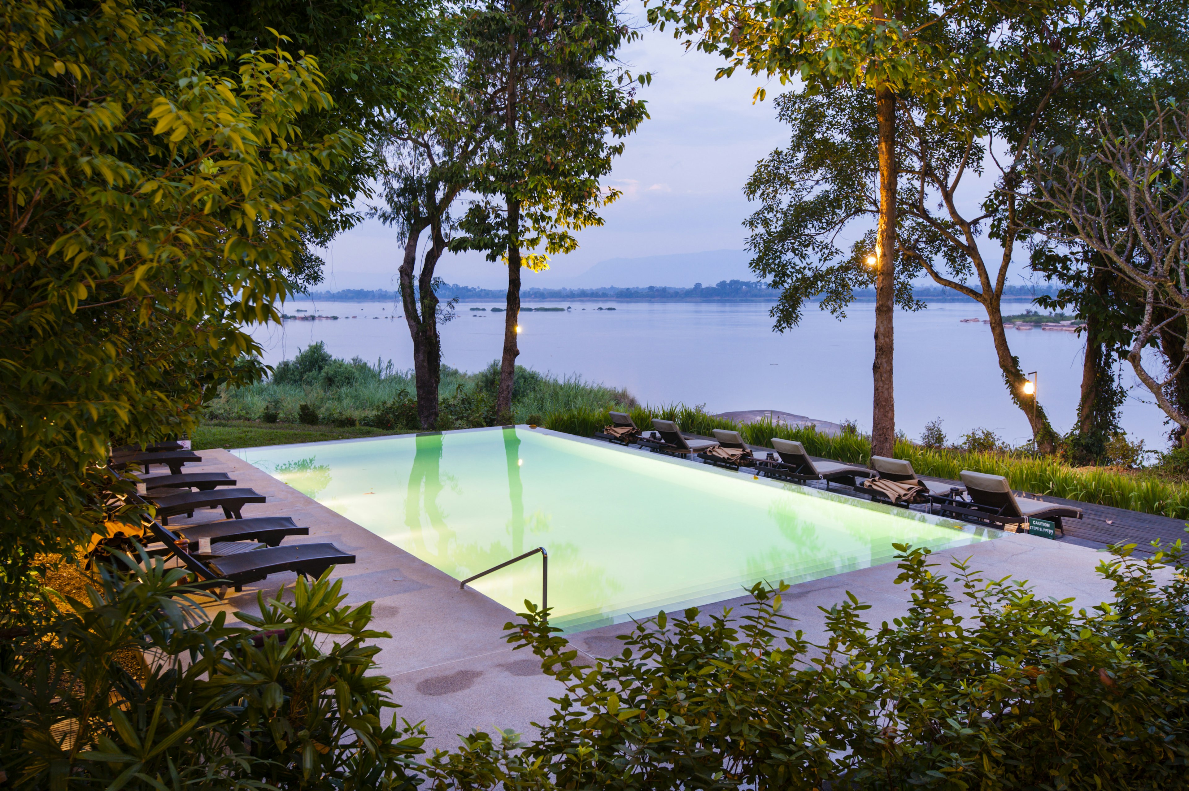 Pool at dusk at River Resort, Champasak, Laos