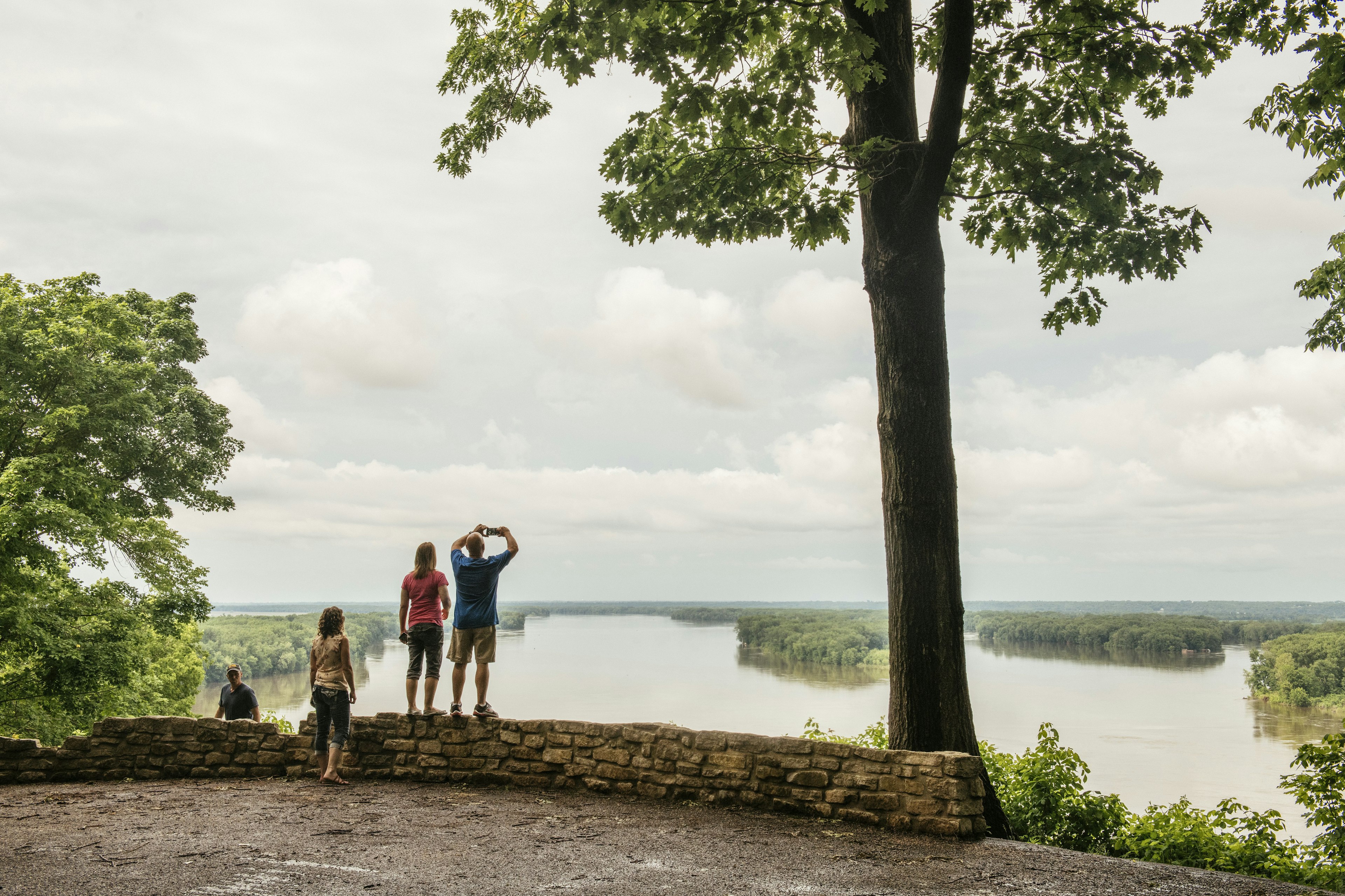 People watch the Mississippi river flowing around Turtle Island at Hannibal