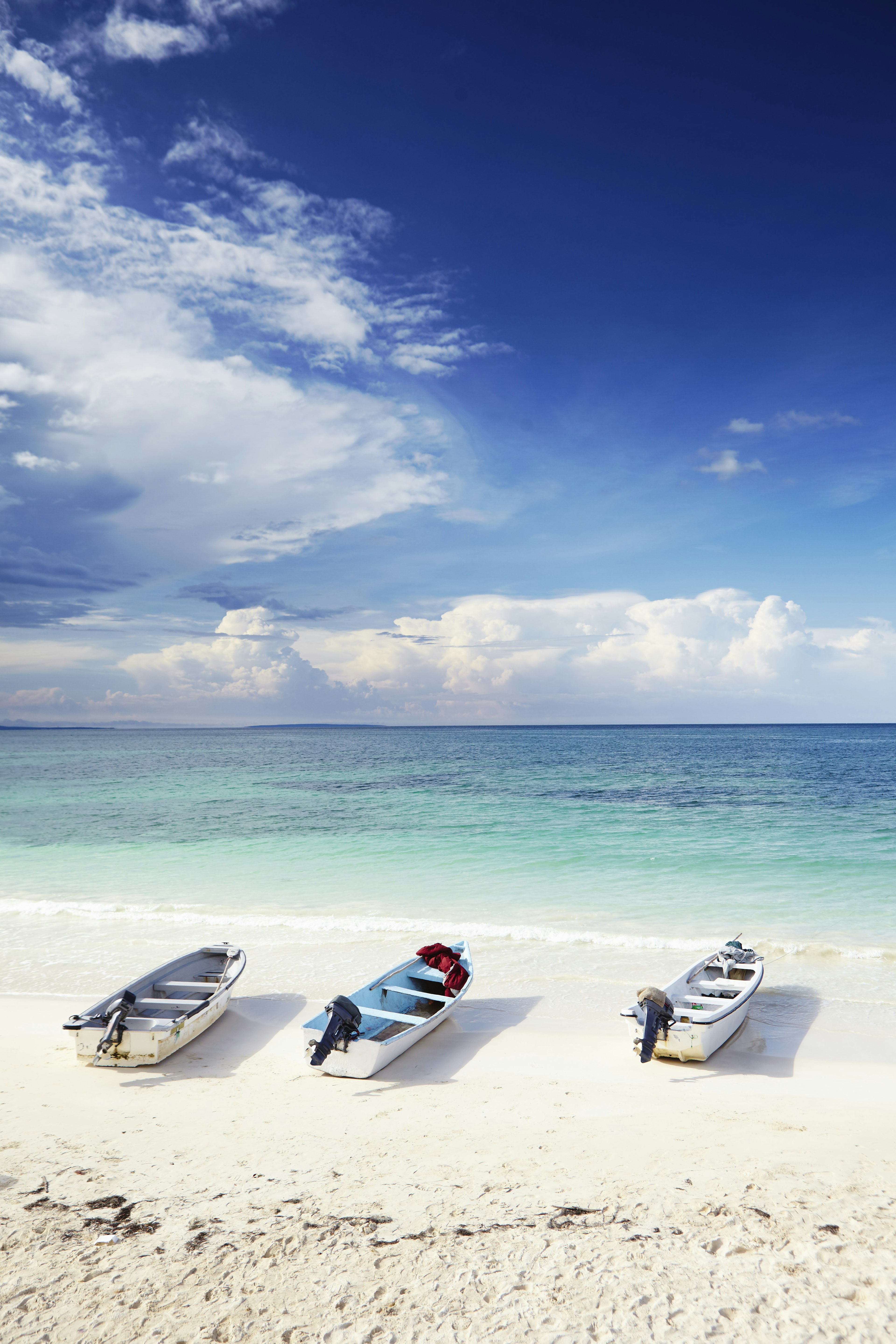 Boats on white sand beach of Bahía de las Águilas.