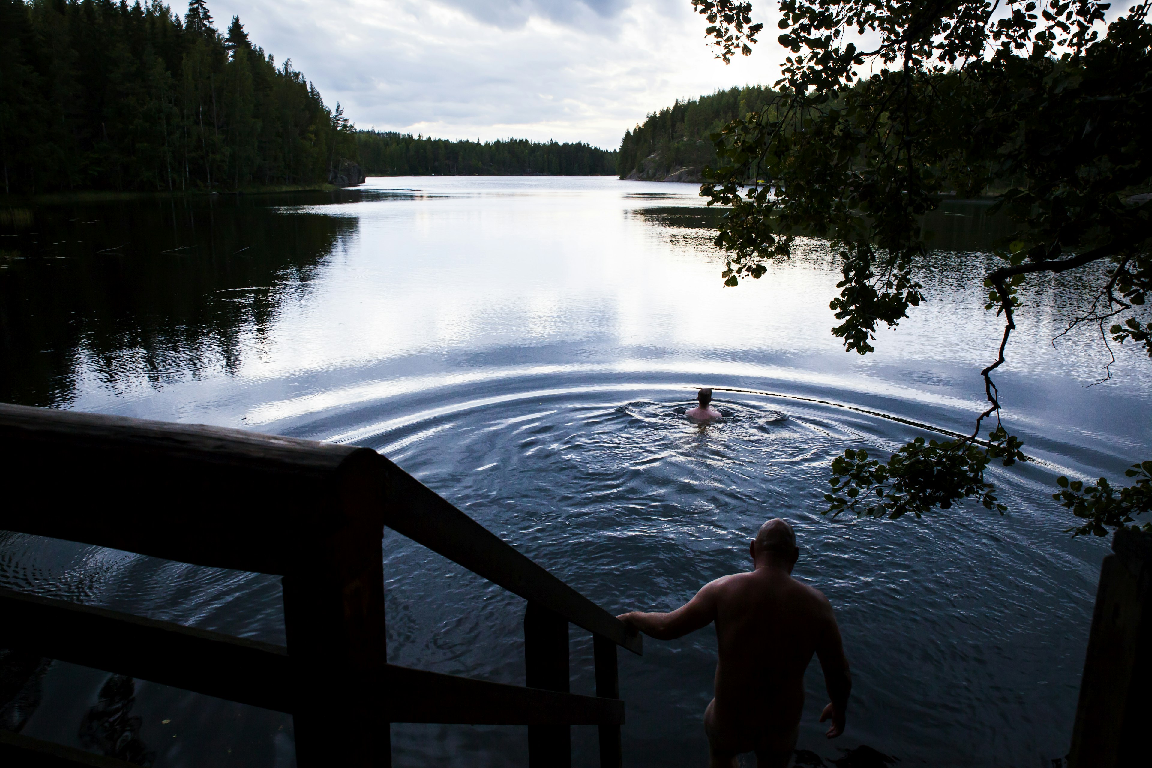 Bathing in Lake Saimaa after a sauna in Finland