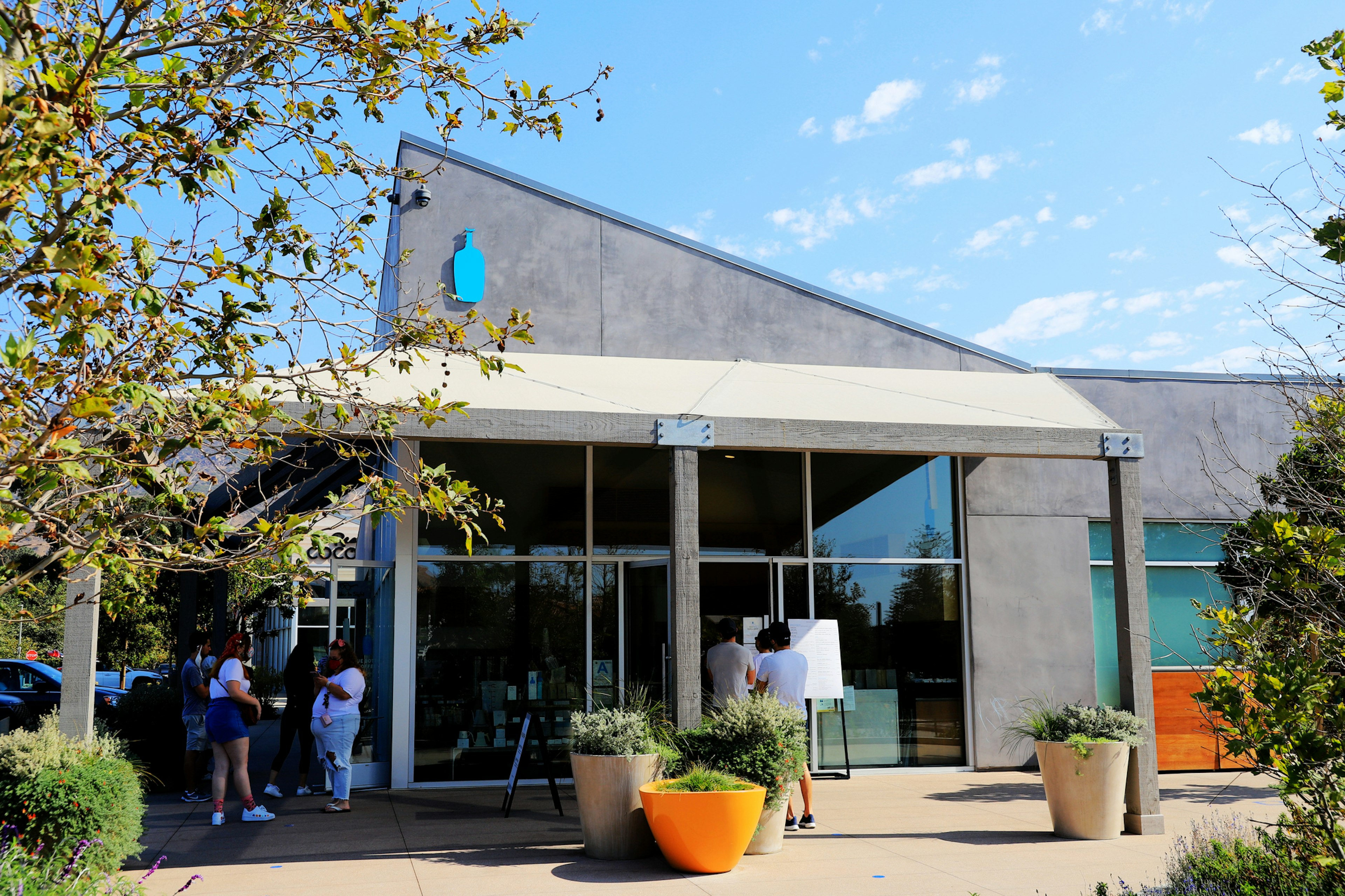 People waiting outside Blue Bottle Coffee at Malibu Country Mart