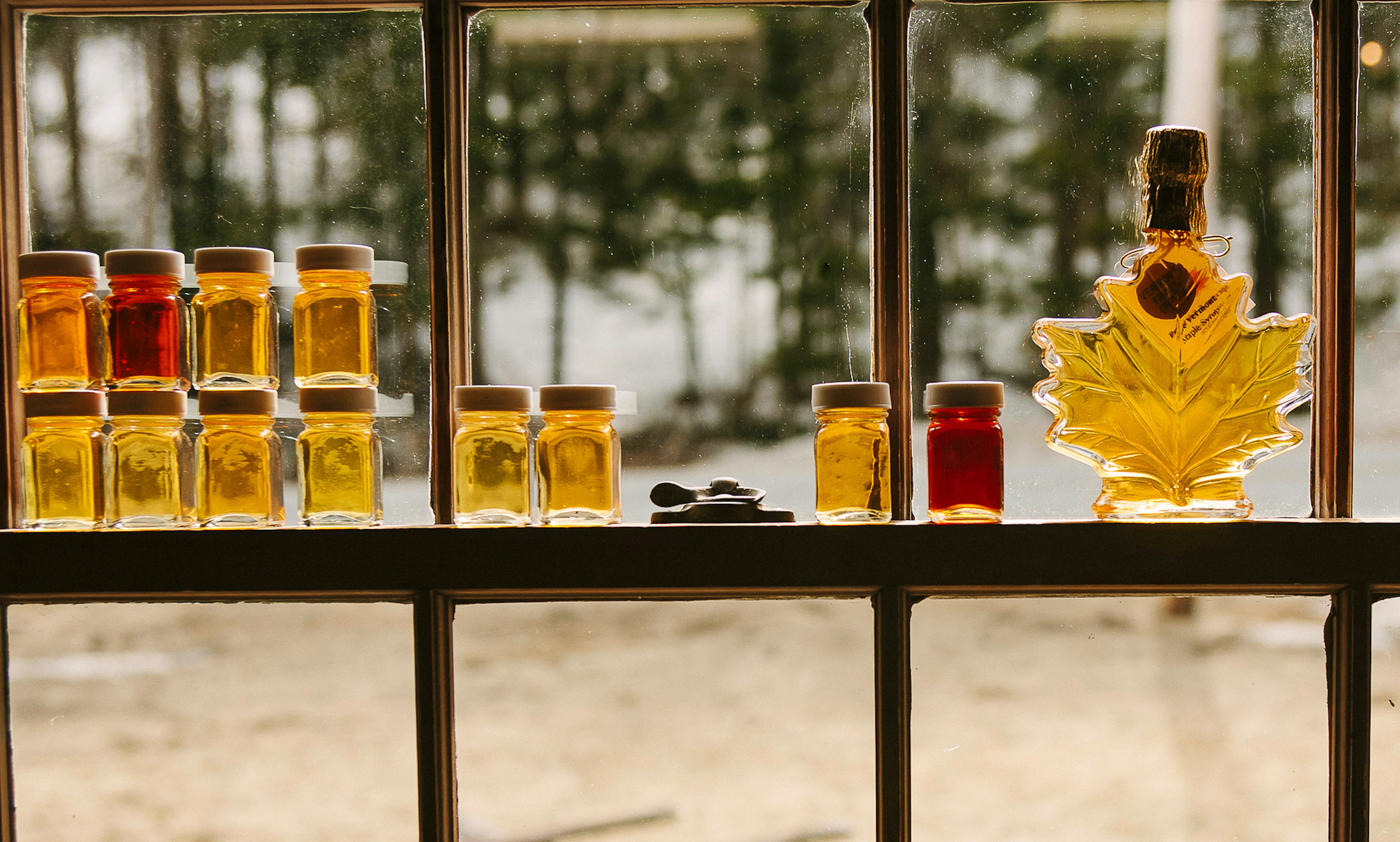 Maple Syrup Grade Display In Window Of Sugar Shack