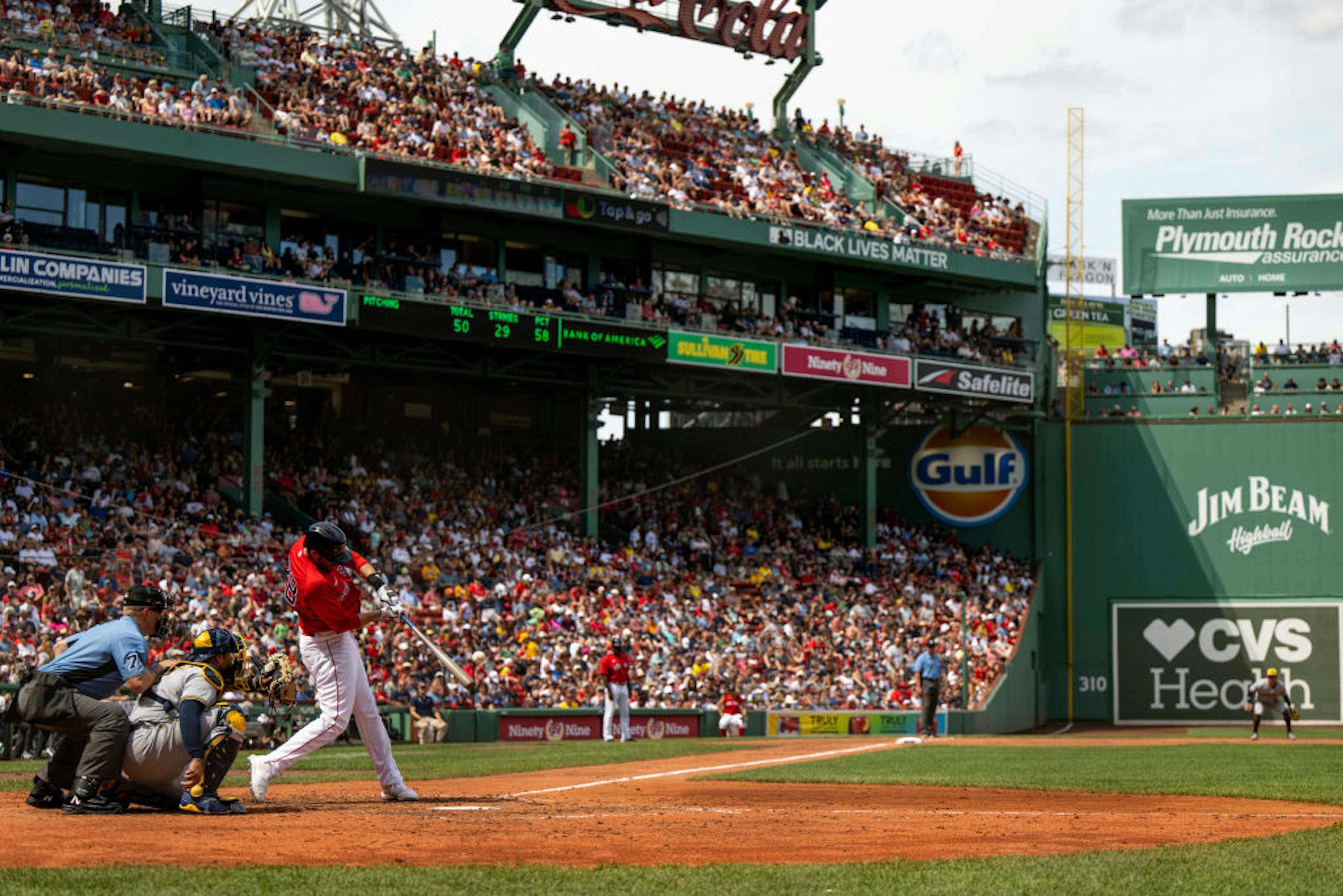 J.D. Martinez #28 of the Boston Red Sox hits a double during the fourth inning of a game against the Milwaukee Brewers on July 31, 2022 at Fenway Park in Boston, Massachusetts.