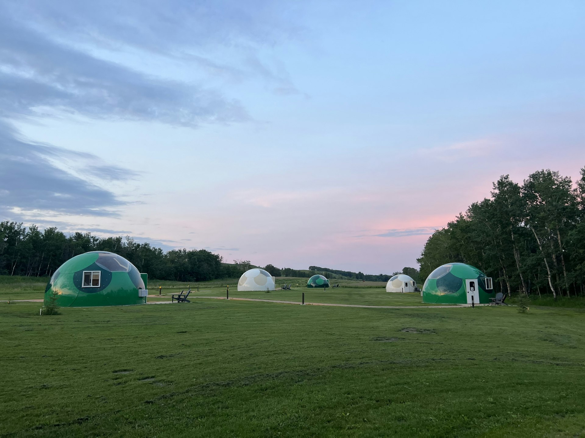 A field with several domes in it that are perfect for stargazing