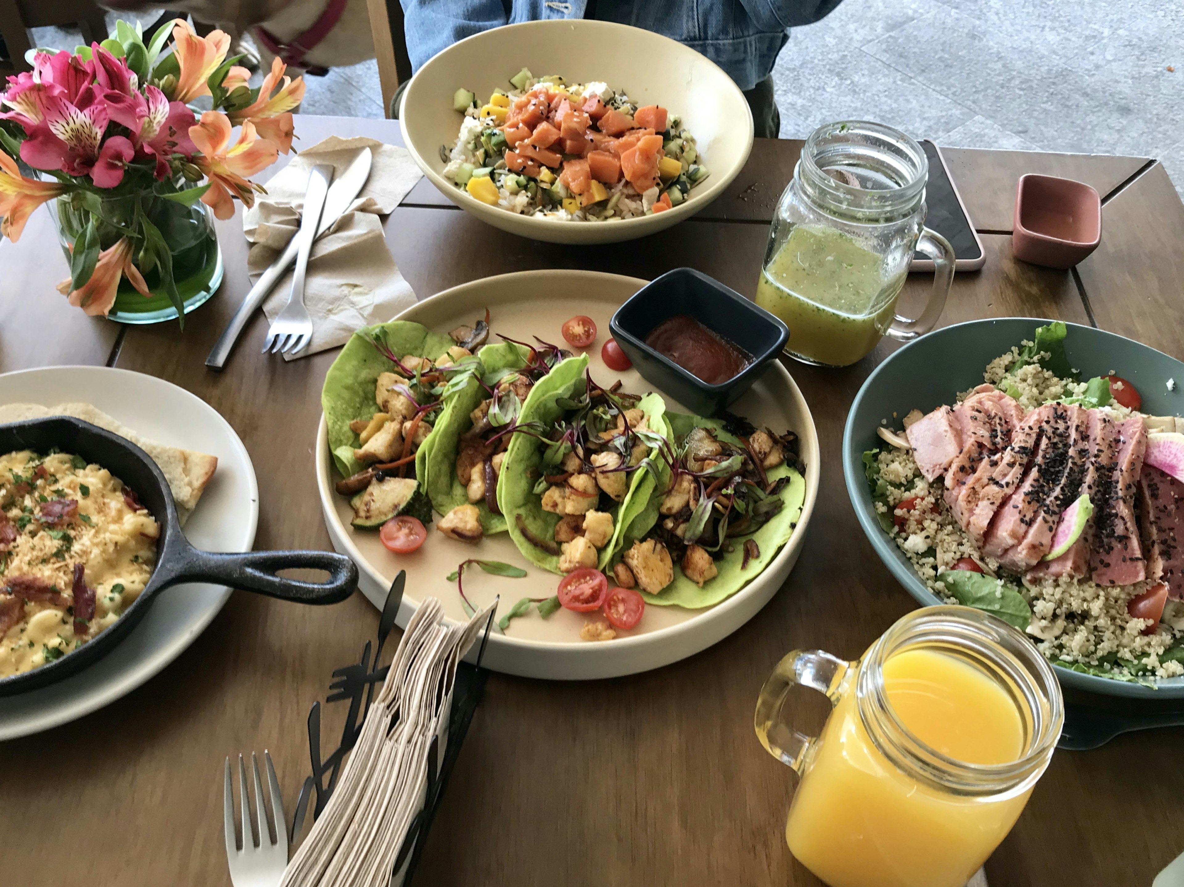 Restaurant table full of Mexican dishes