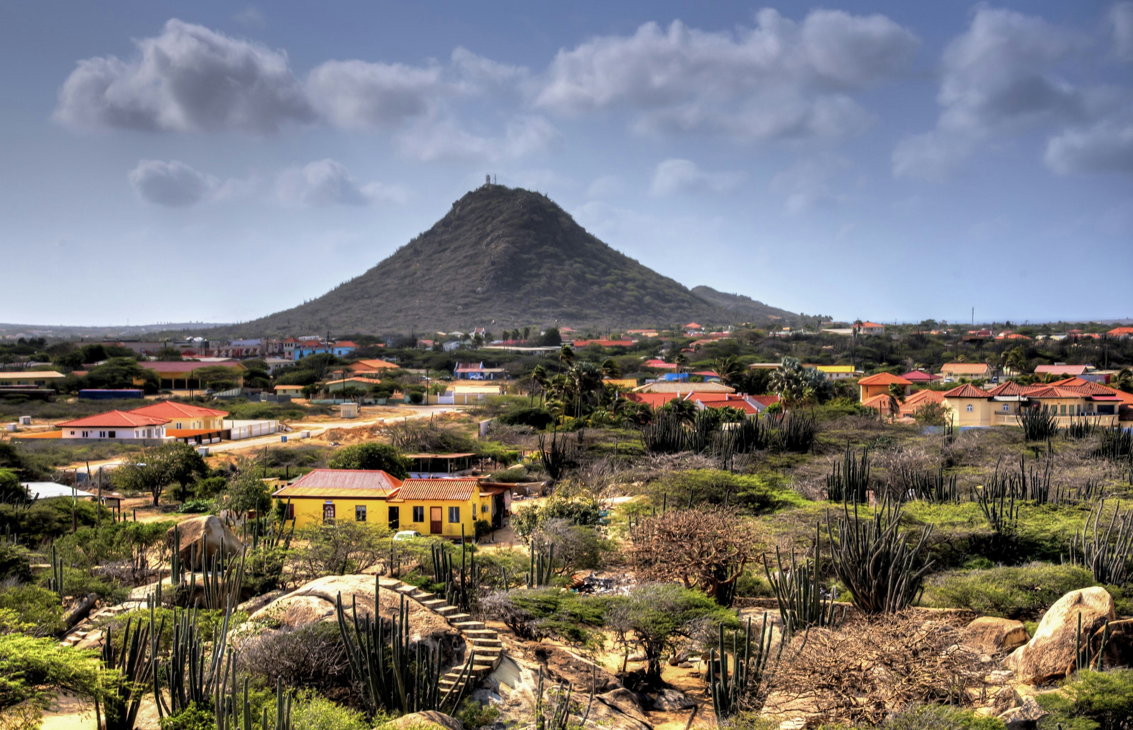 Landscape shot of Mt. Hooiberg looming over the Aruba landscape.