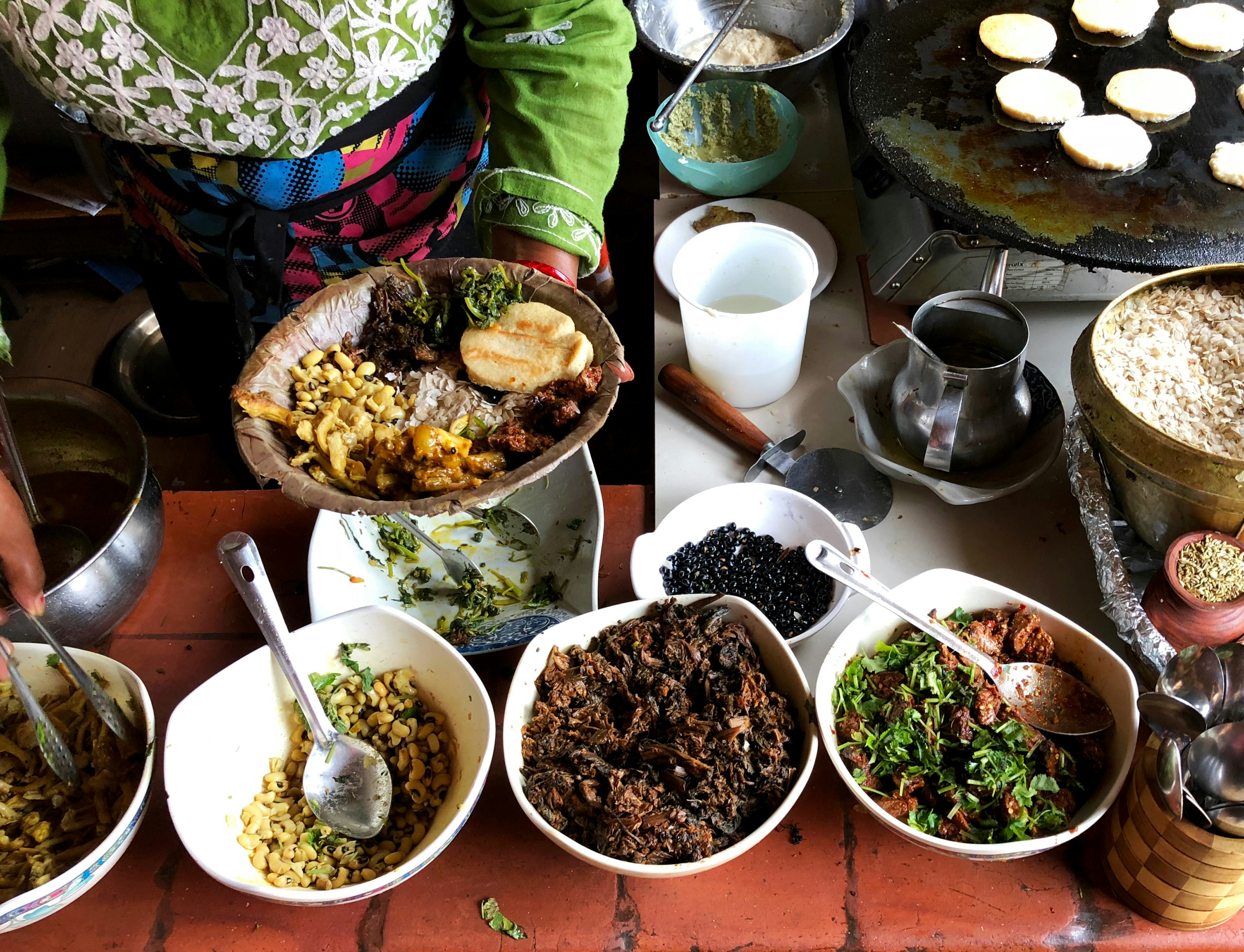 A woman serving Newari food in Kathmandu