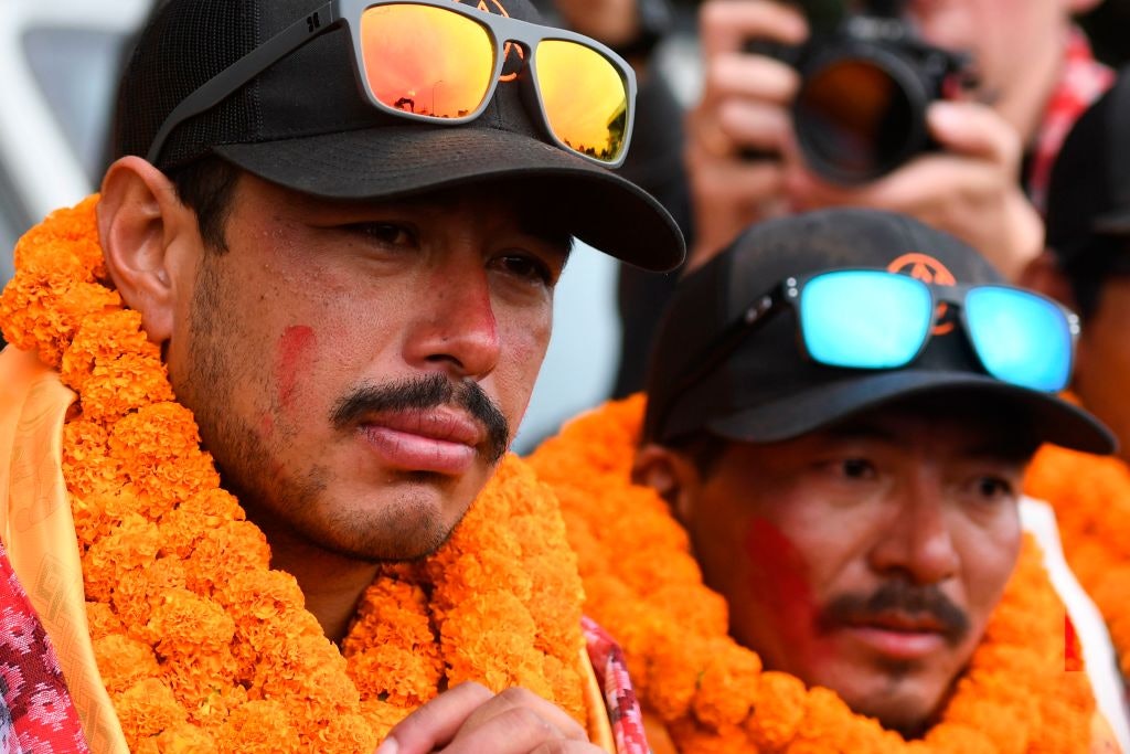 Mountaineer Nirmal Purja (L) looks on next to teammate Mingma David Sherpa