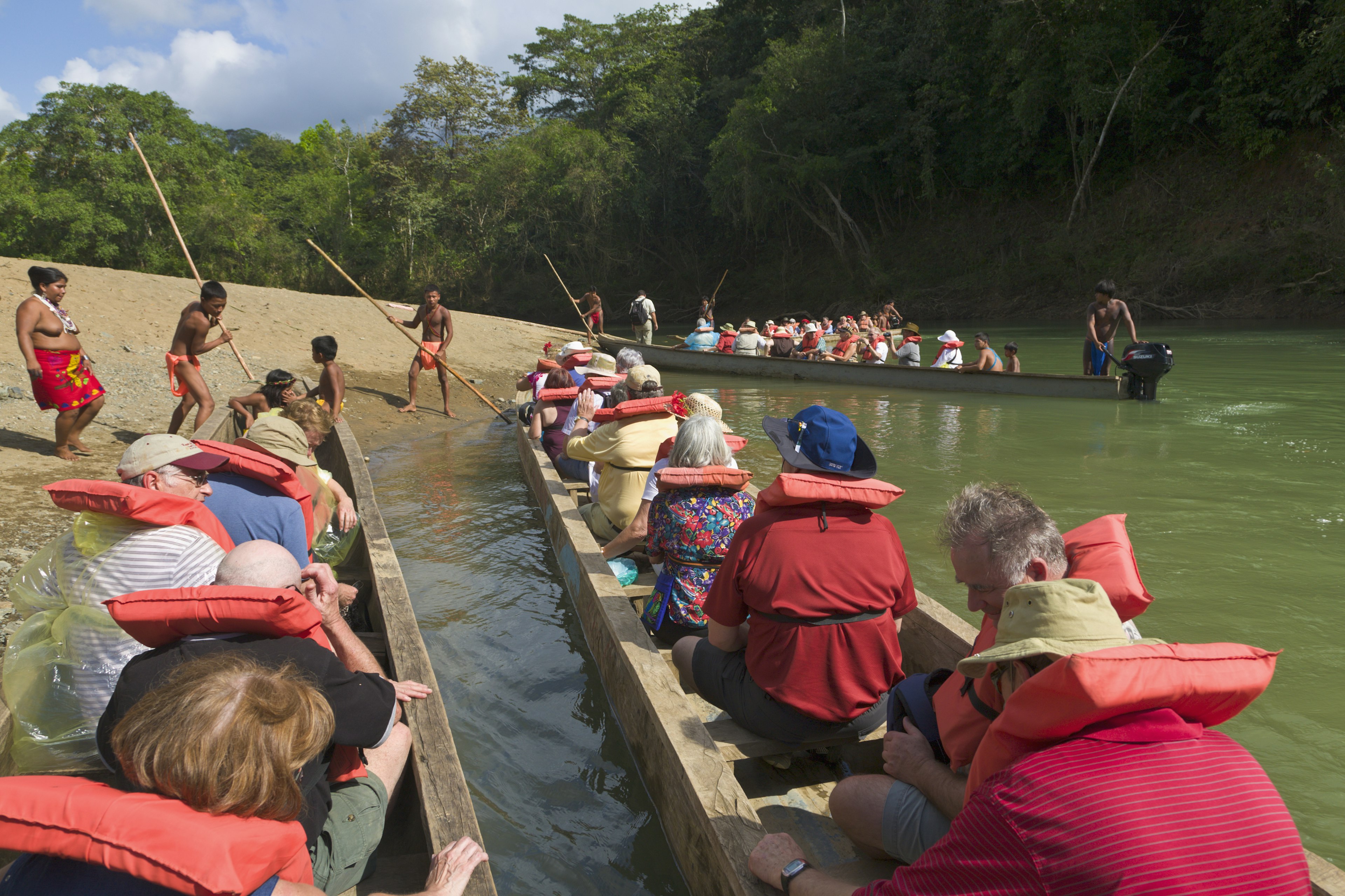 Tourists arrive at Embera village by piragua, Panama