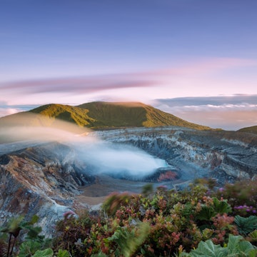 High angle view of crater emitting smoke at sunset, Poas volcano, Costa Rica