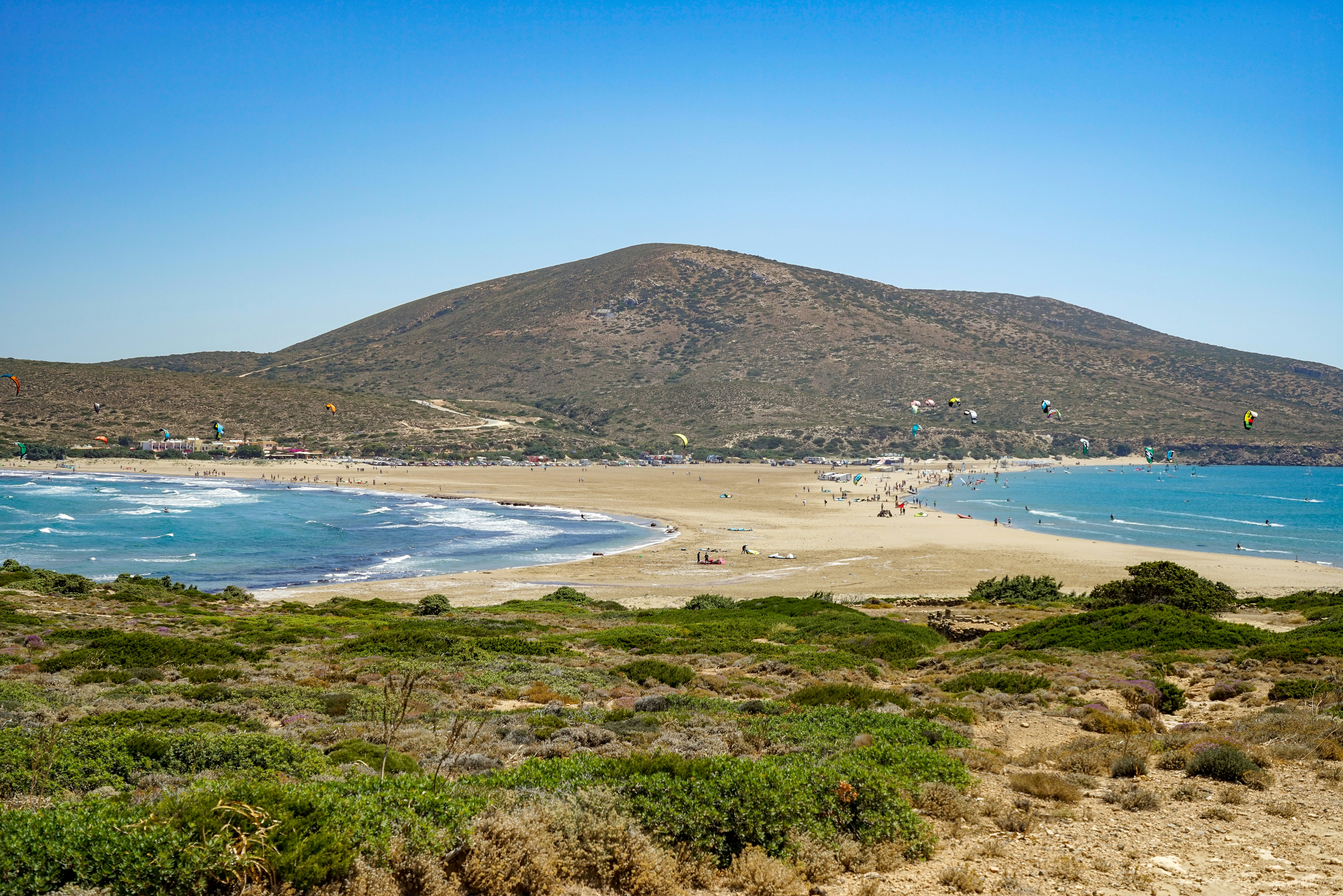 An aerial view of Prasonisi Beach in Rhodes, Greece. The beach is actually a sand bar, connecting the main island with a small islet off shore.