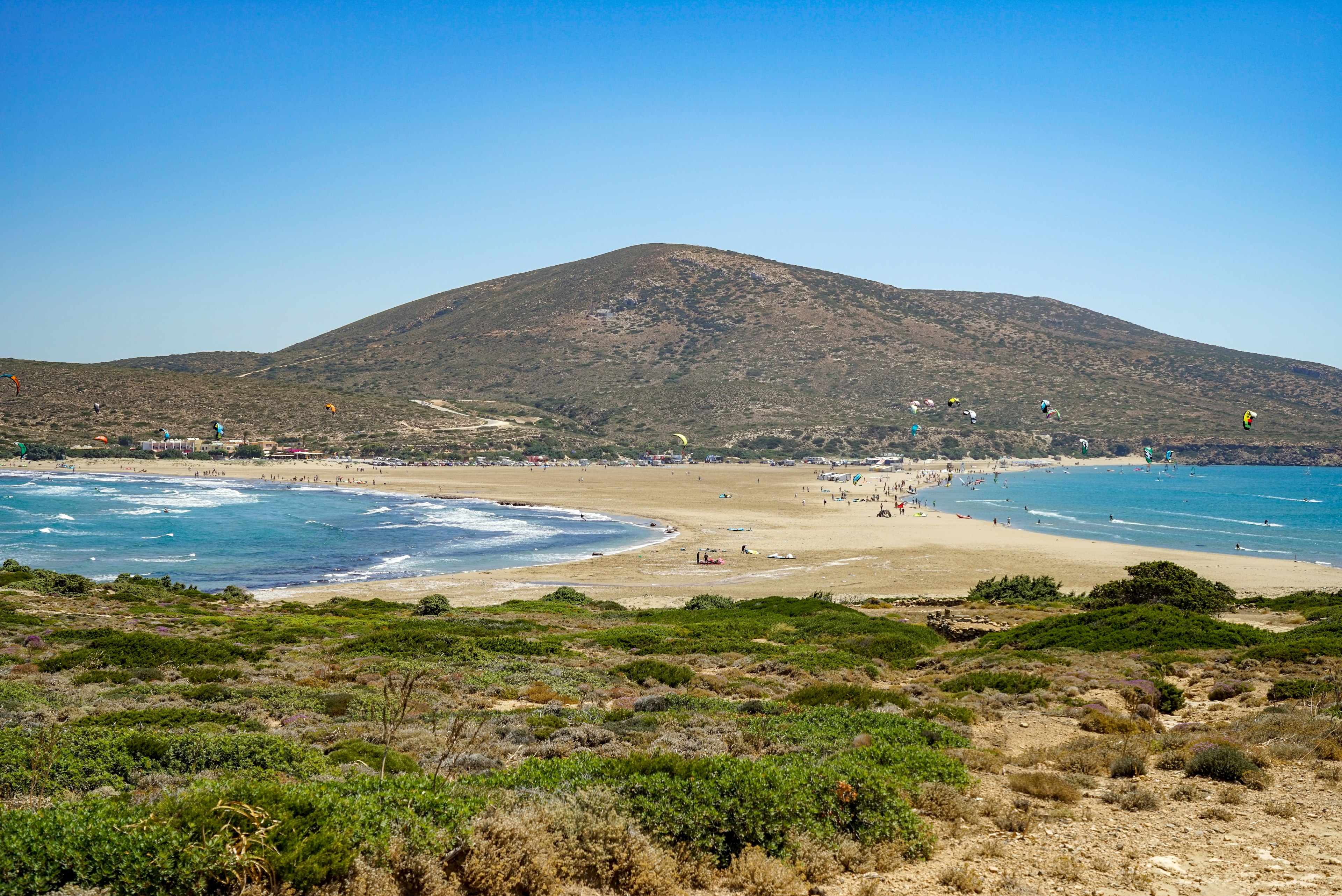 An aerial view of Prasonisi Beach in Rhodes, Greece. The beach is actually a sand bar, connecting the main island with a small islet off shore.