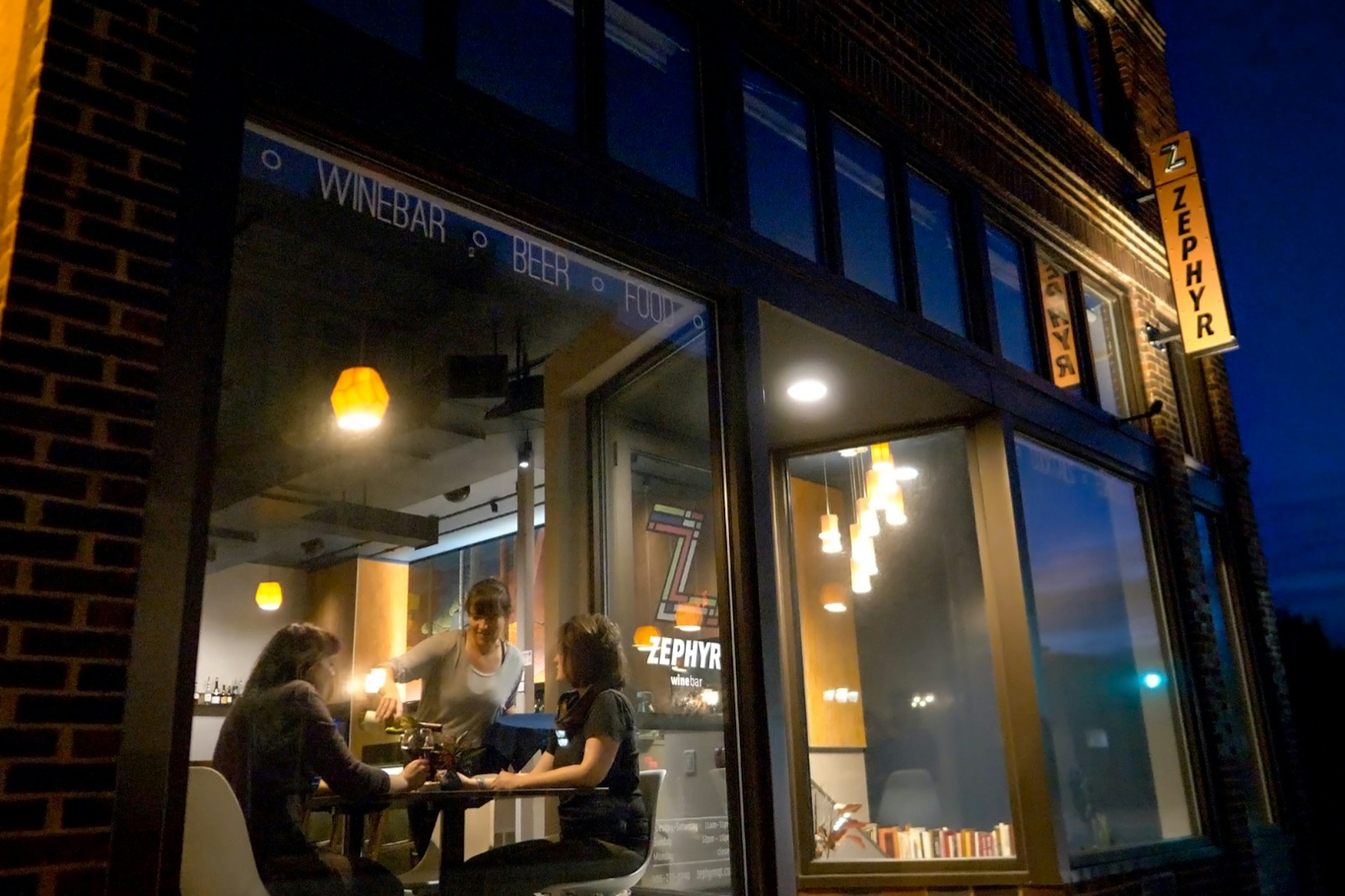 Window With Diners in Cafe Restaurant at night