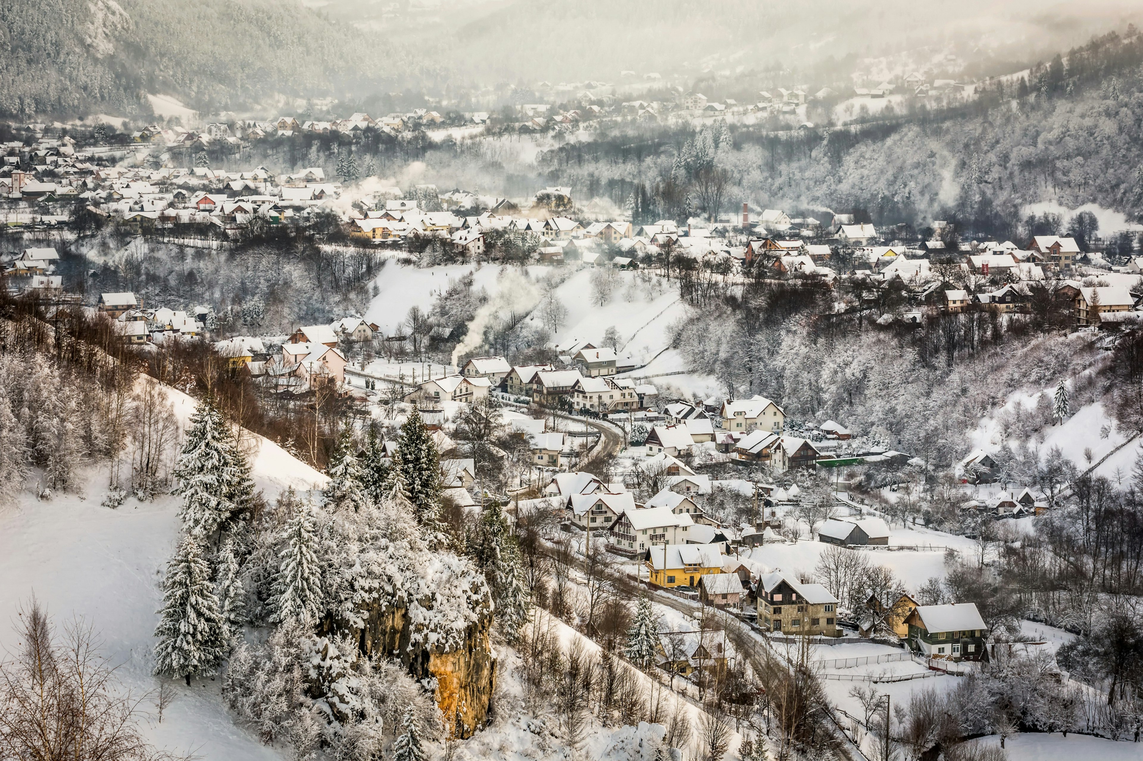 A snowy view over village houses at Bran, Transylvania, Romania.