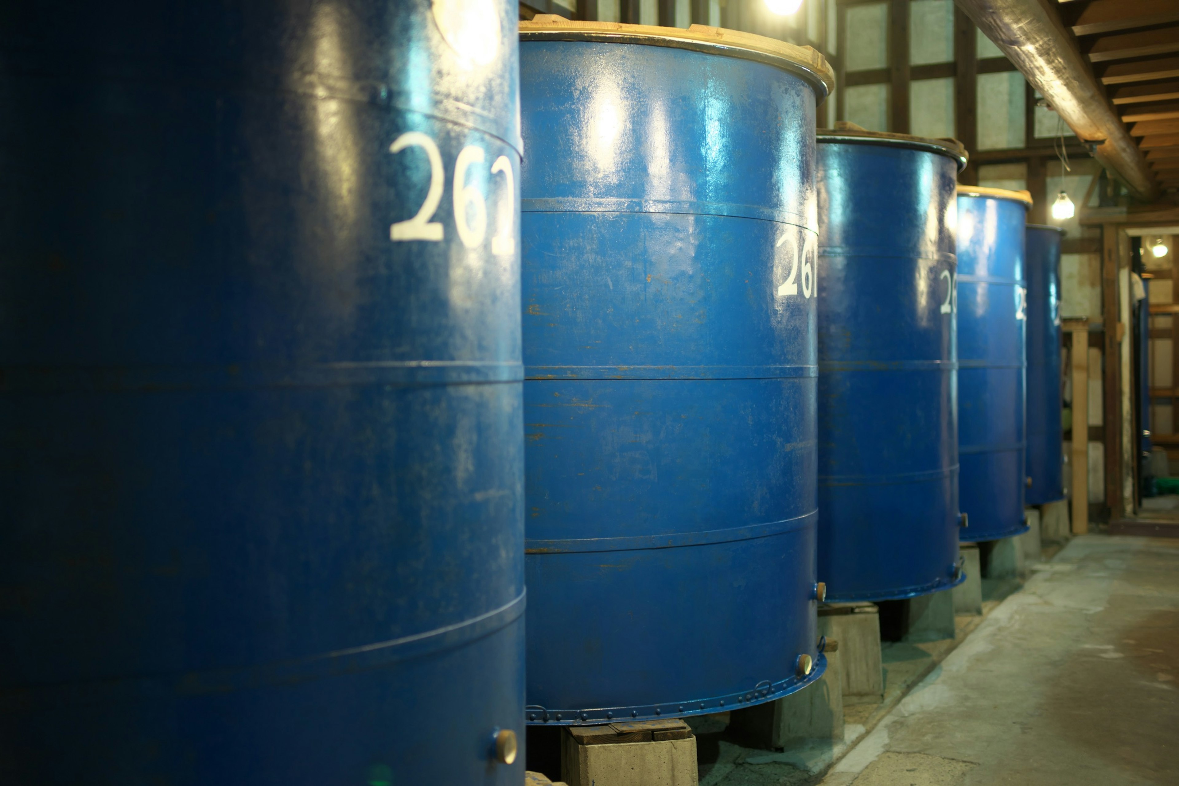 Big enamel Sake storage tanks at sake brewery in Akita, Japan