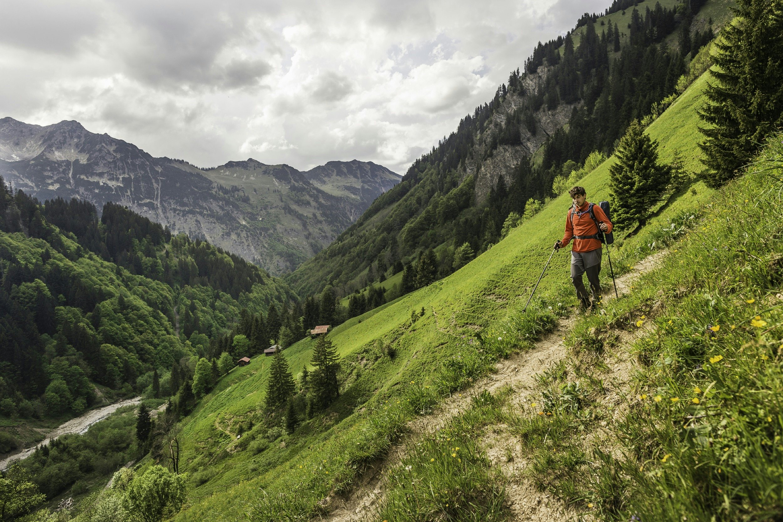 Young man hiking on valley path, Oberstdorf, Bavaria, Germany