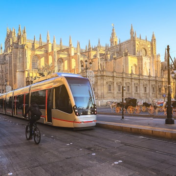 Tram in front of Cathedral of Seville, this is one of the most popular landmark in Seville, Spain; Shutterstock ID 1279438279; your: Claire Naylor; gl: 65050; netsuite: Online Ed; full: Getting around seville