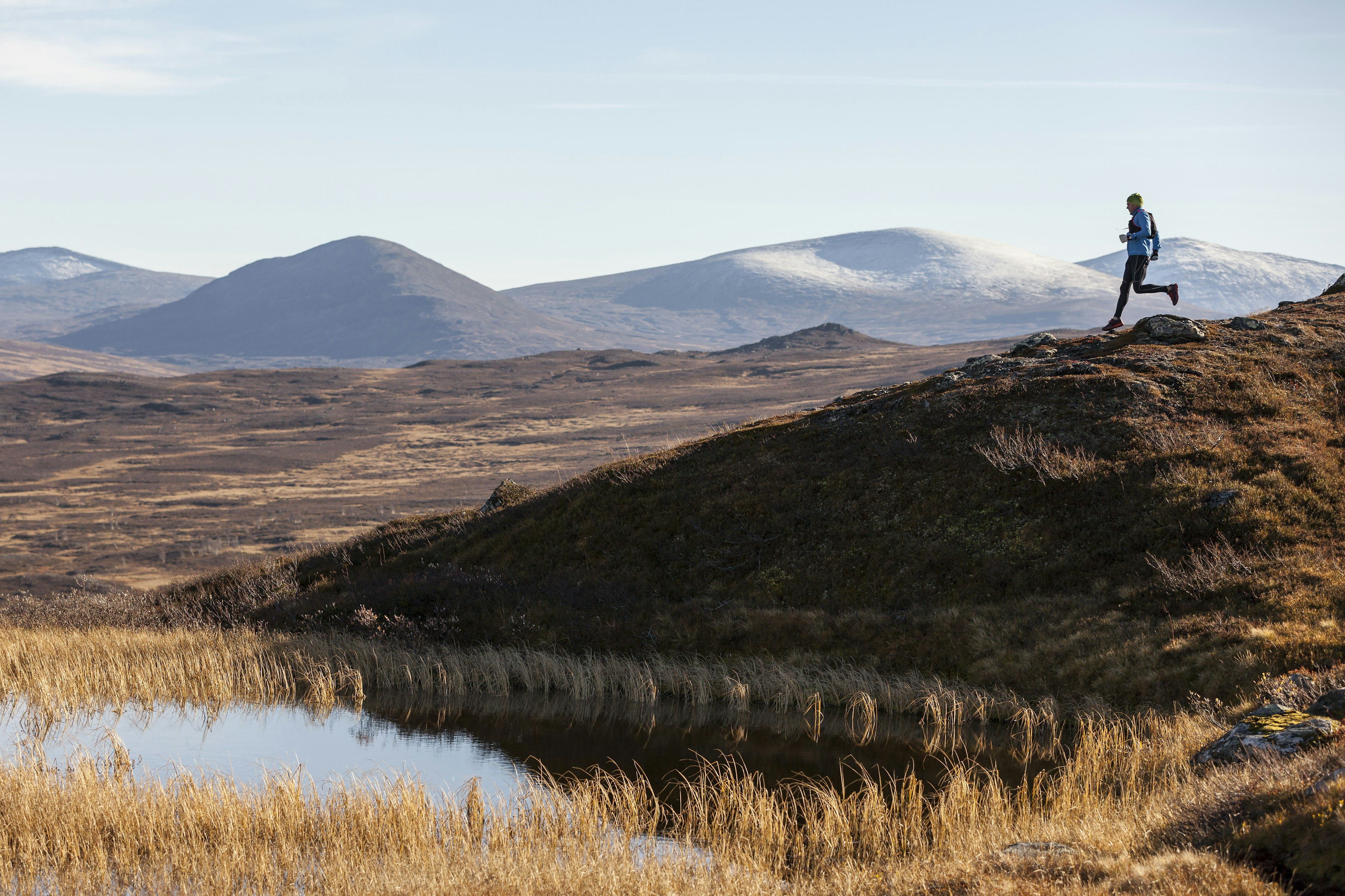 A runner crossing an empty Swedish landscape in Lappland