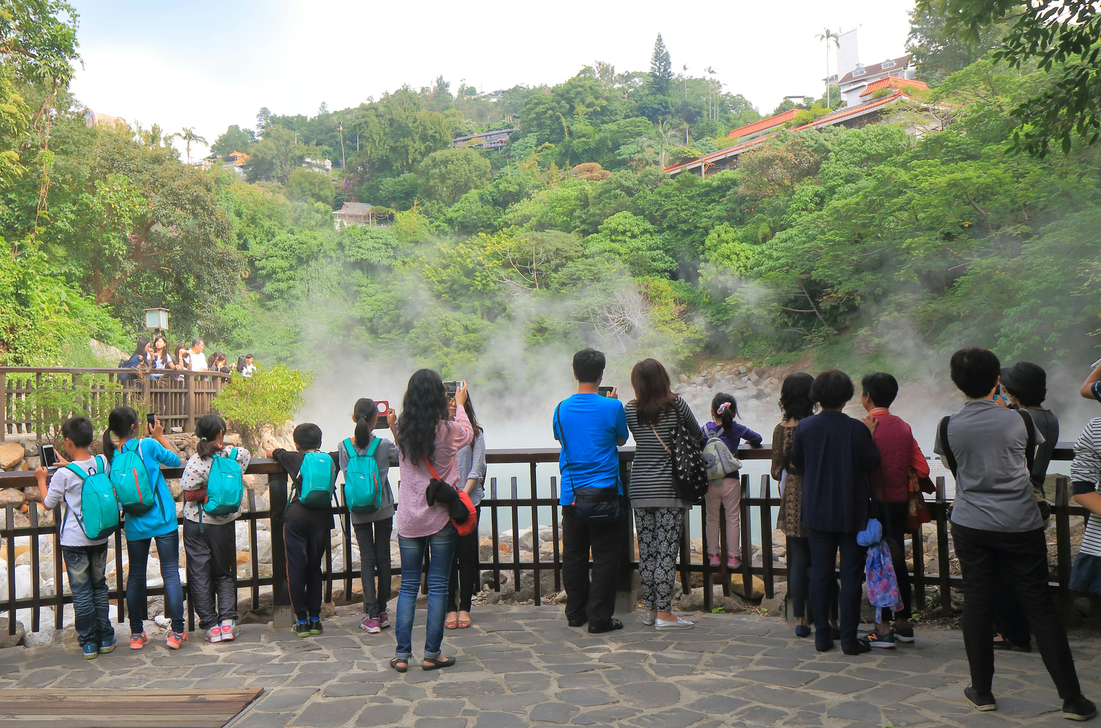 Visitors taking photos of Thermal Valley Beitou hot springs in Taipei