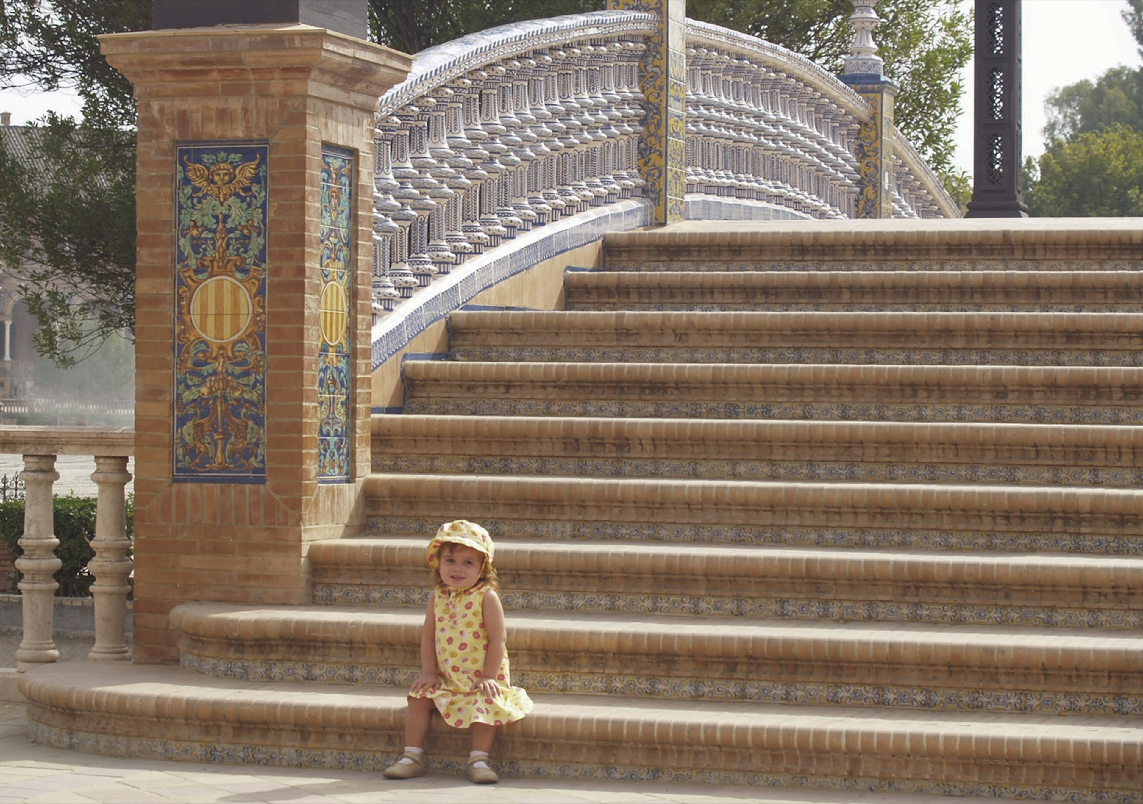 Toddler girl sitting on stairs