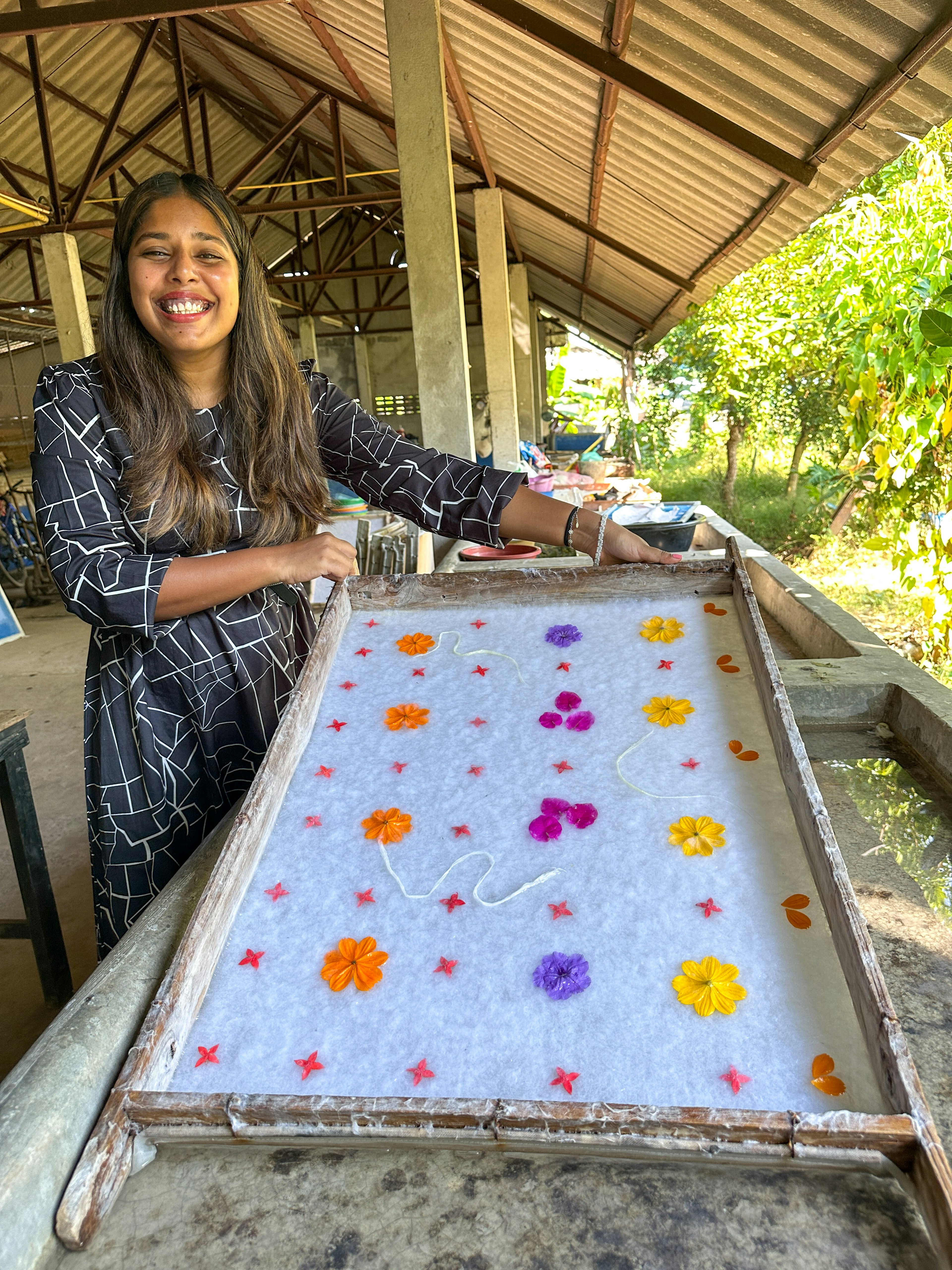 Woman shows us her traditional papermaking in a class in Chiang Mai Thailand